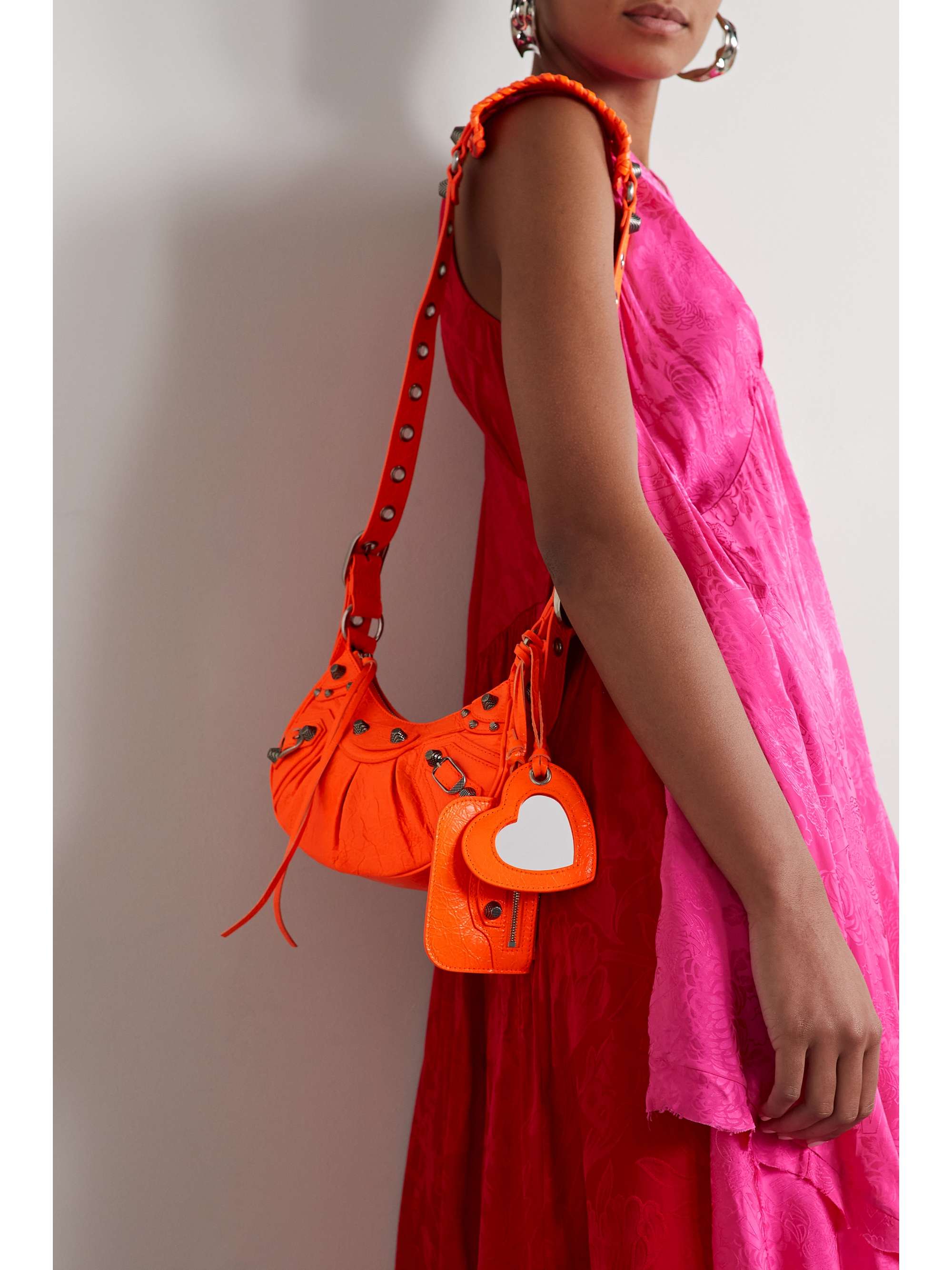 BALENCIAGA Le Cagole XS studded neon crinkled-leather shoulder bag