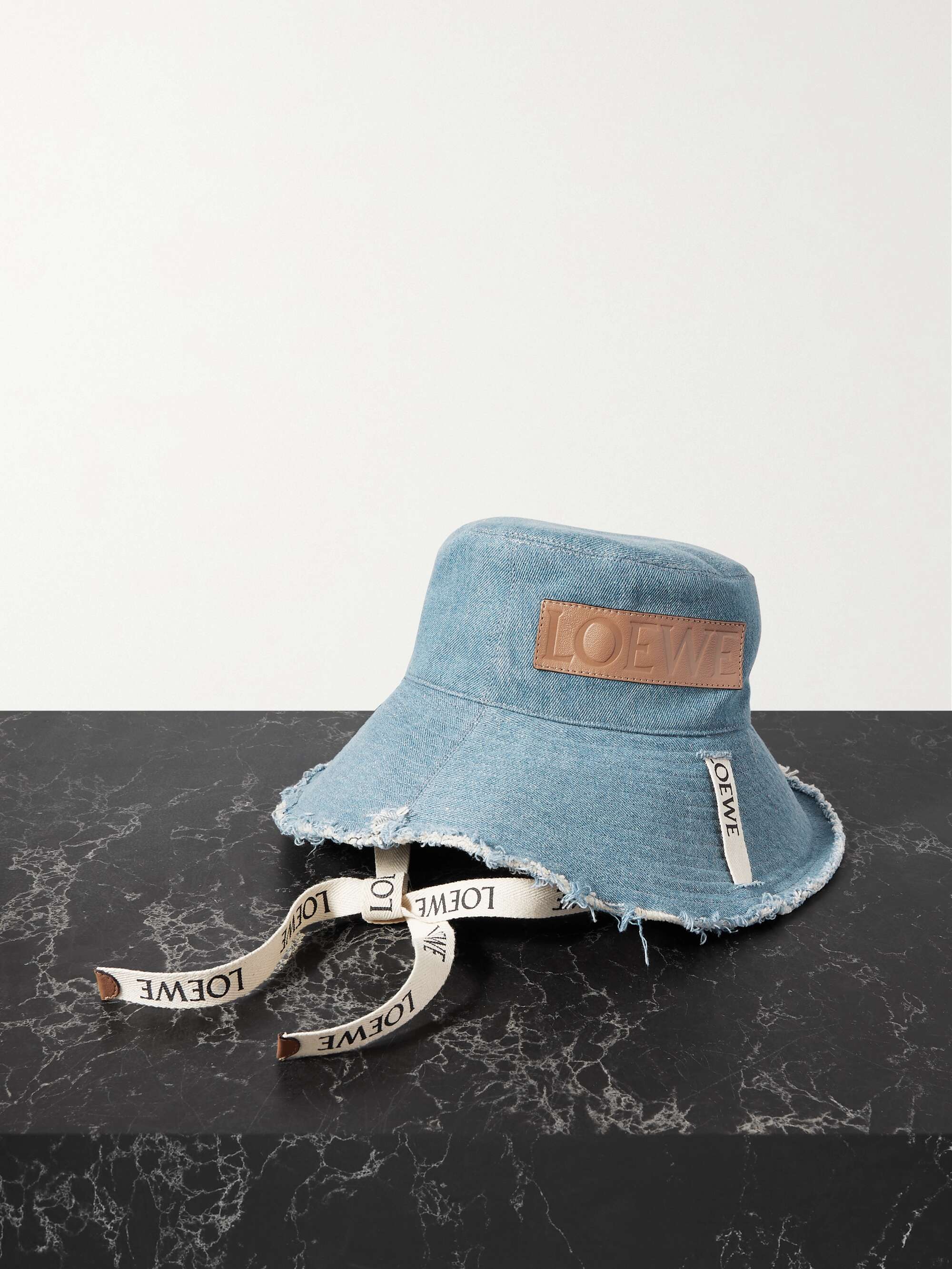 + Paula's Ibiza leather-trimmed frayed denim bucket hat