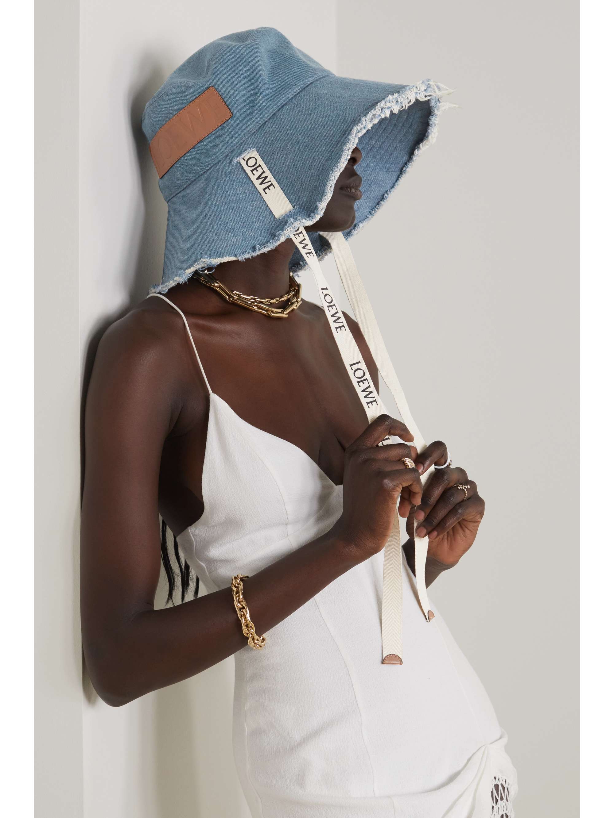 + Paula's Ibiza leather-trimmed frayed denim bucket hat