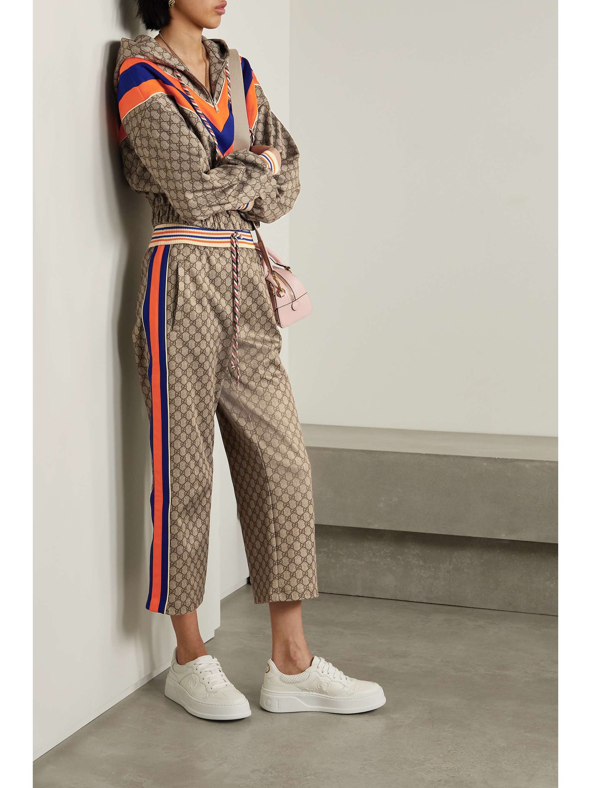 GUCCI Angela Nguyen Cropped Webbing trimmed Printed Jersey Flared Pants NET A PORTER gucci-angela-nguyen-cropped-webbing-trimmed-printed-jersey-flared-pants-net-a-porter