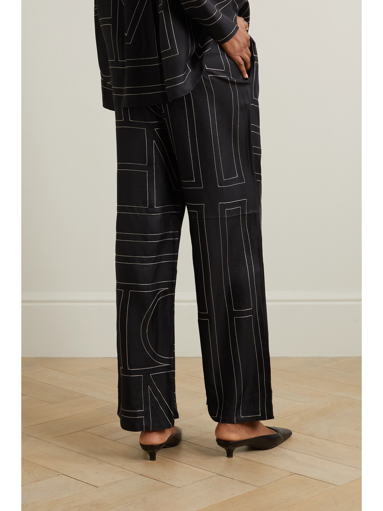 Shop Totême Embroidered Silk-twill Wide-leg Pants In Black