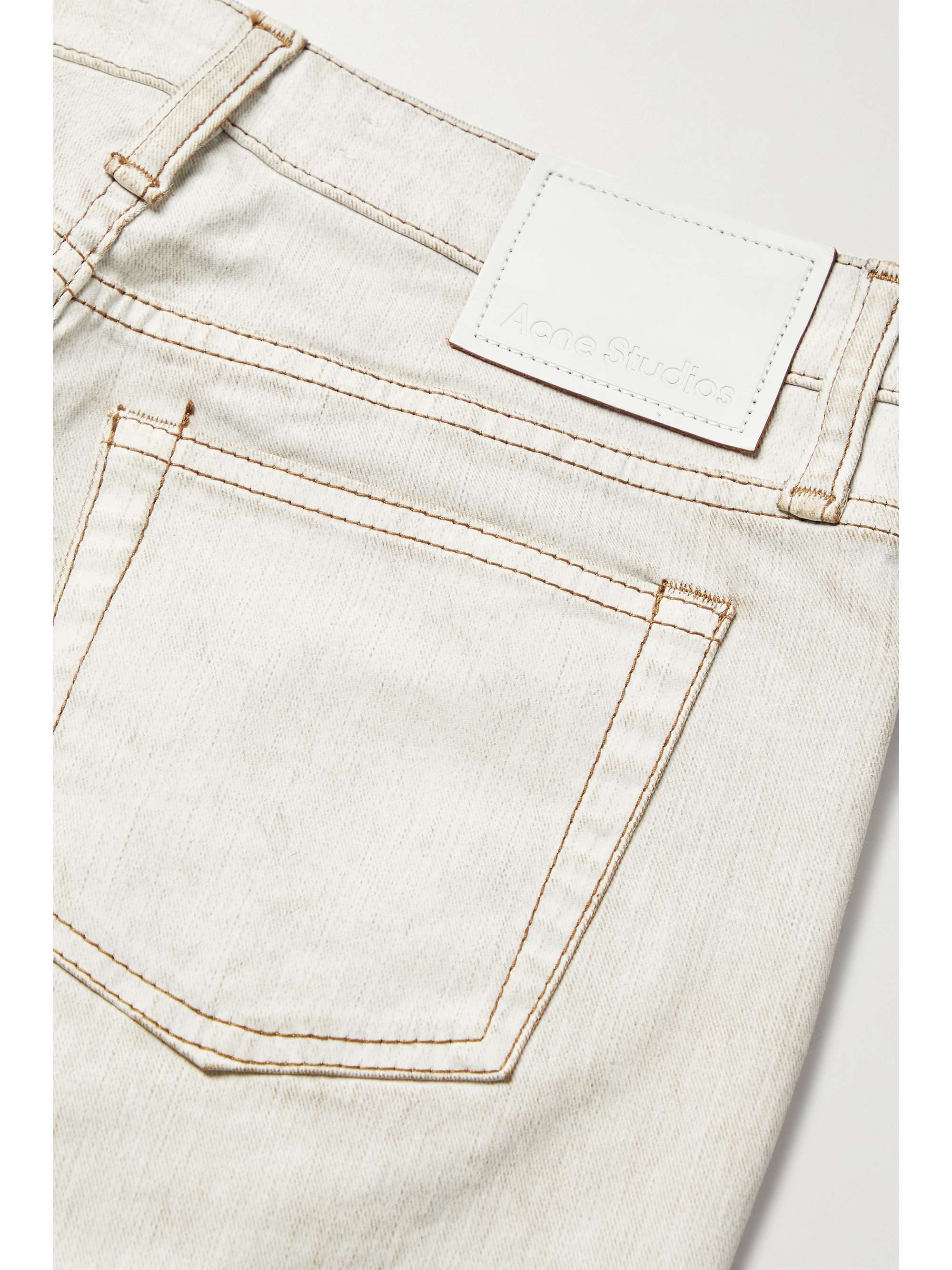 ACNE STUDIOS Ruched low-rise flared coated-denim jeans