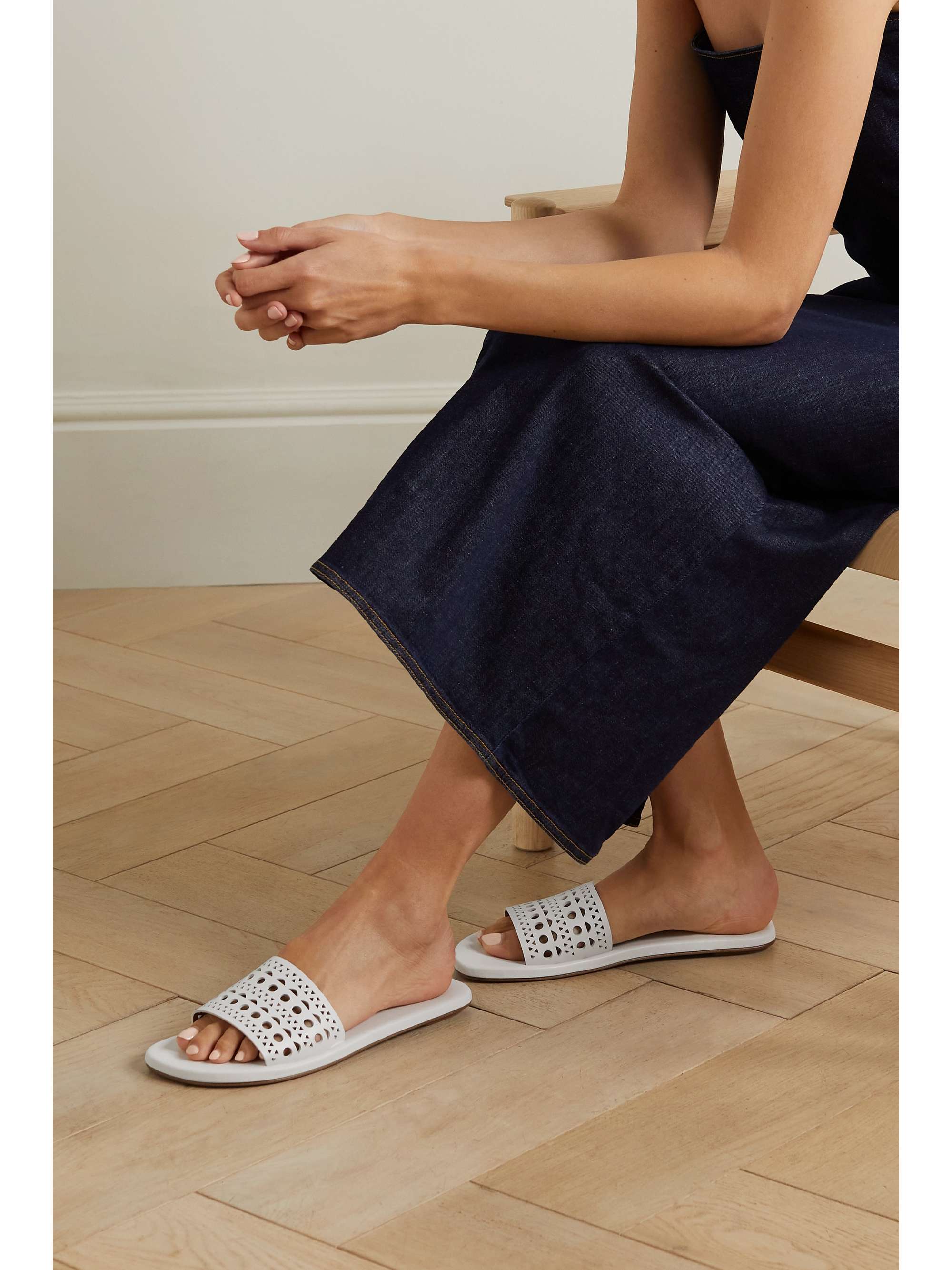 ALA A Laser cut leather slides NET A PORTER