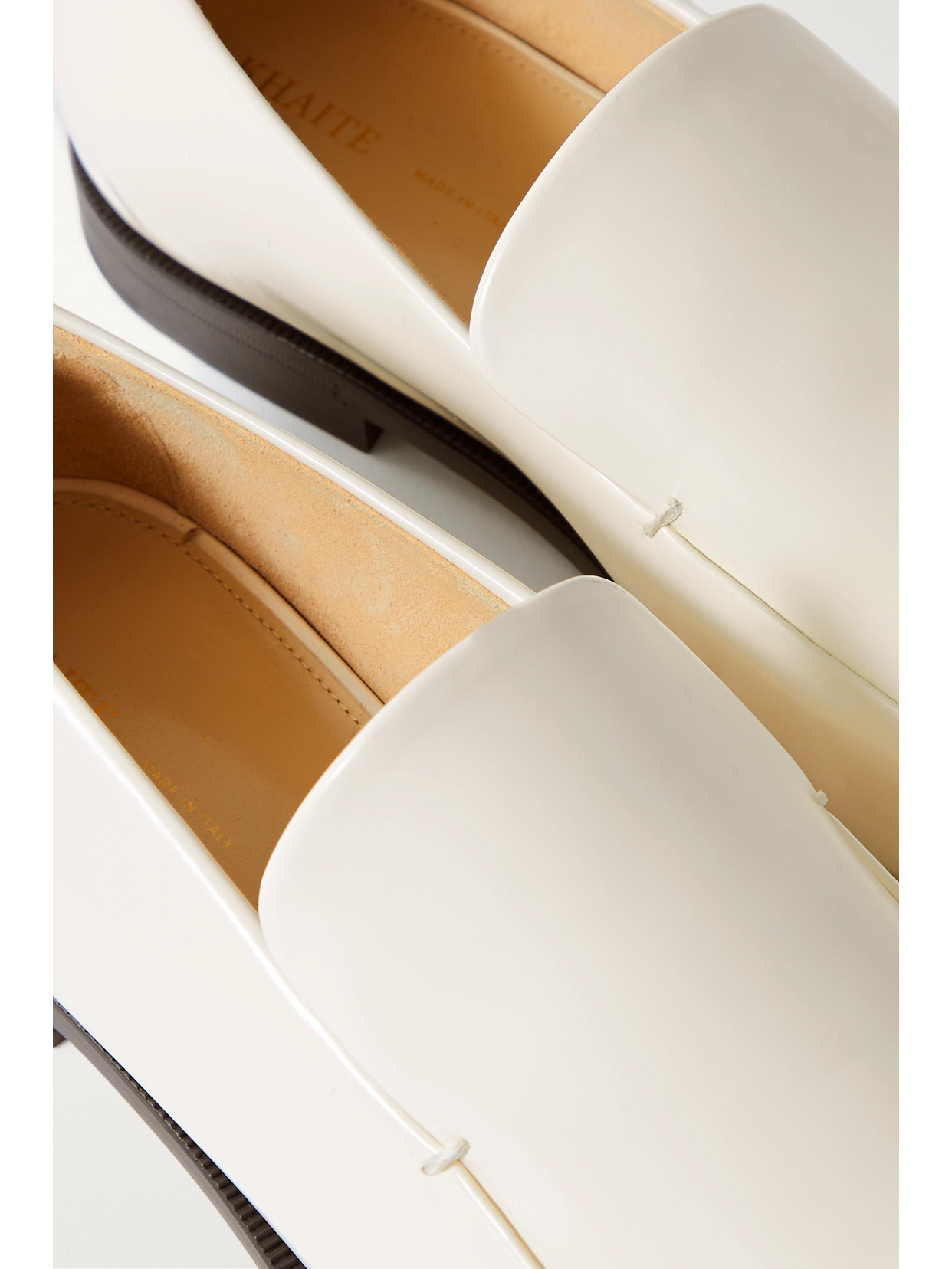 Khaite Alessio Glossed-leather Loafers In Off-white