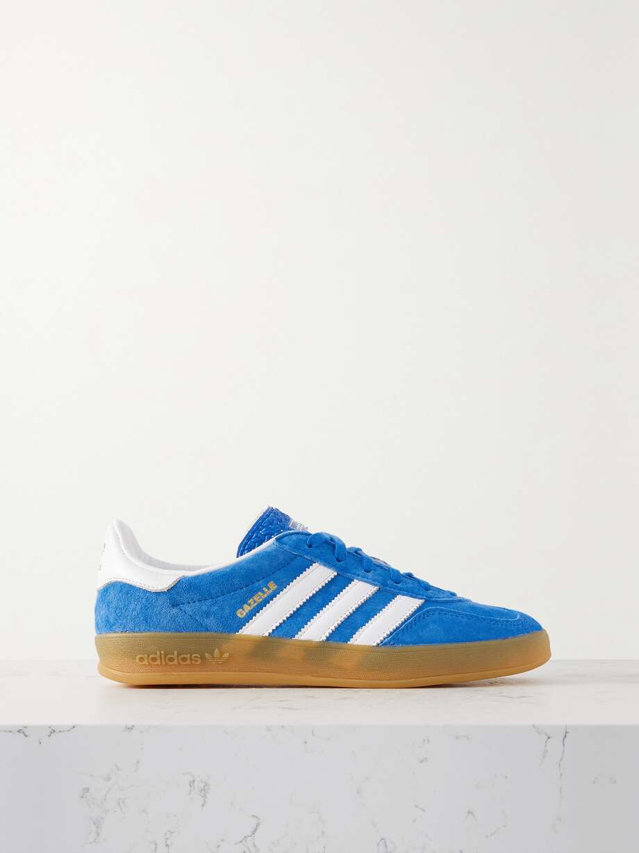 adidas Originals' 'Gazelle Indoor' sneakers were initially released in the '70s as an indoor sports shoe that's since grown to become an iconic streetwear staple. This iteration is made from 'Bluebird' suede with smooth leather stripes and gummed rubber soles.
