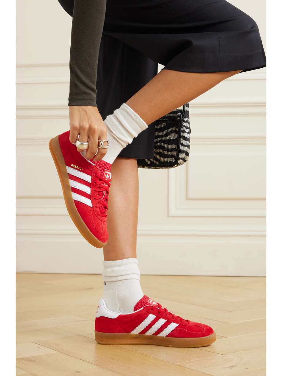 adidas Originals' 'Gazelle Indoor' sneakers were initially released in the '70s as an indoor sports shoe that's since grown to become an iconic streetwear staple. This iteration is made from scarlet suede with smooth leather stripes and gummed rubber soles.