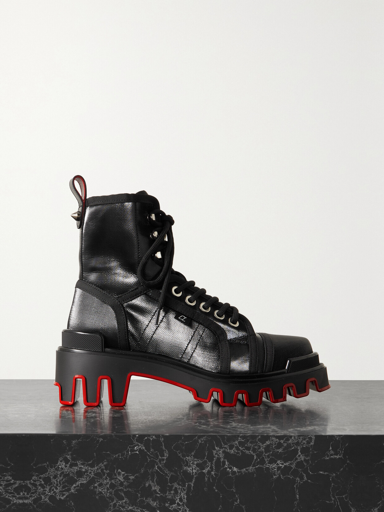 Lacquered women's black work boots with a red sole