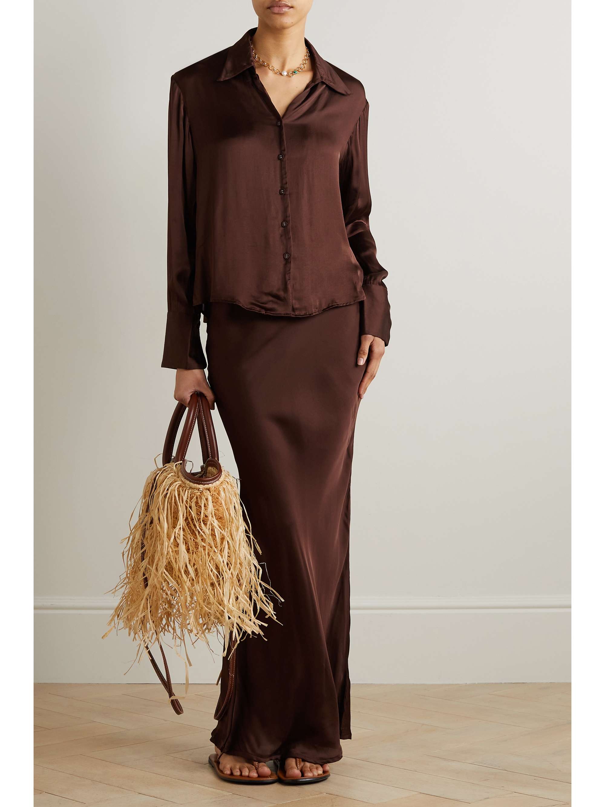 Tap into the fashion colour trends 2024 with this Faithfull The Brand's 'Fransica' shirt in chocolate brown. Handmade in Bali by local artisans. It's cut for a relaxed fit from glossy LENZING™ ECOVERO™-satin in a deep 'Dark Truffle'. Wear yours with the matching 'Ancora' skirt and strappy sandals.

