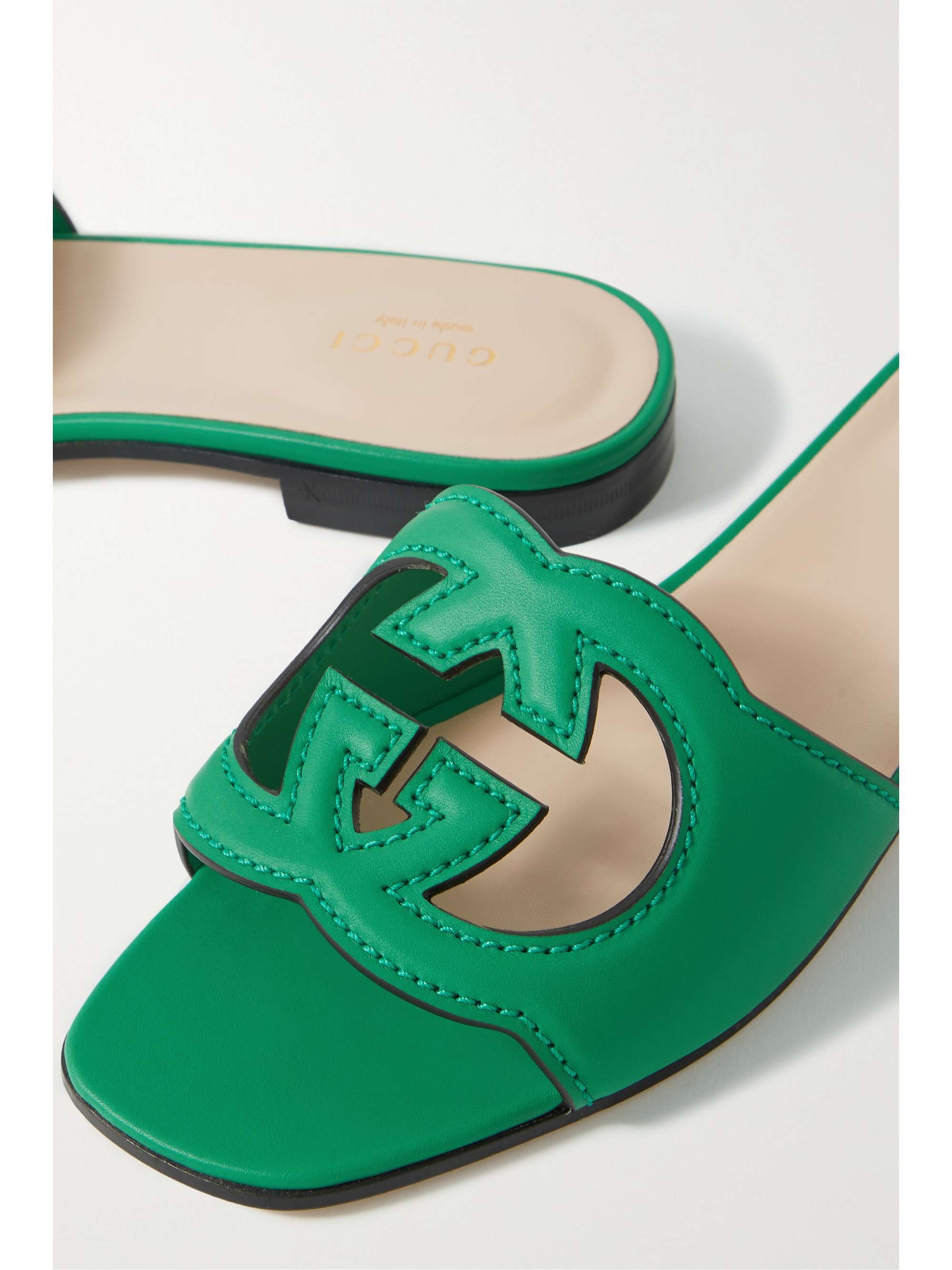GUCCI Cutout leather slides NETAPORTER
