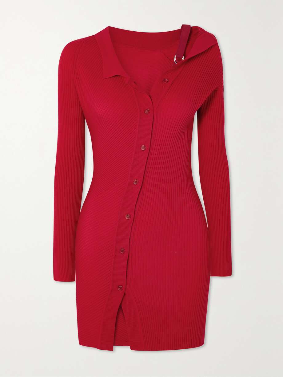 Jacquemus' viral 'Le Chouchou' collection red Rib-knitted wool-blend 'Colin' mini dress has an asymmetric grosgrain strap with the lineup's new silver hardware. Shirt collar, long sleeves, asymmetric button up front and figure hugging fit. 