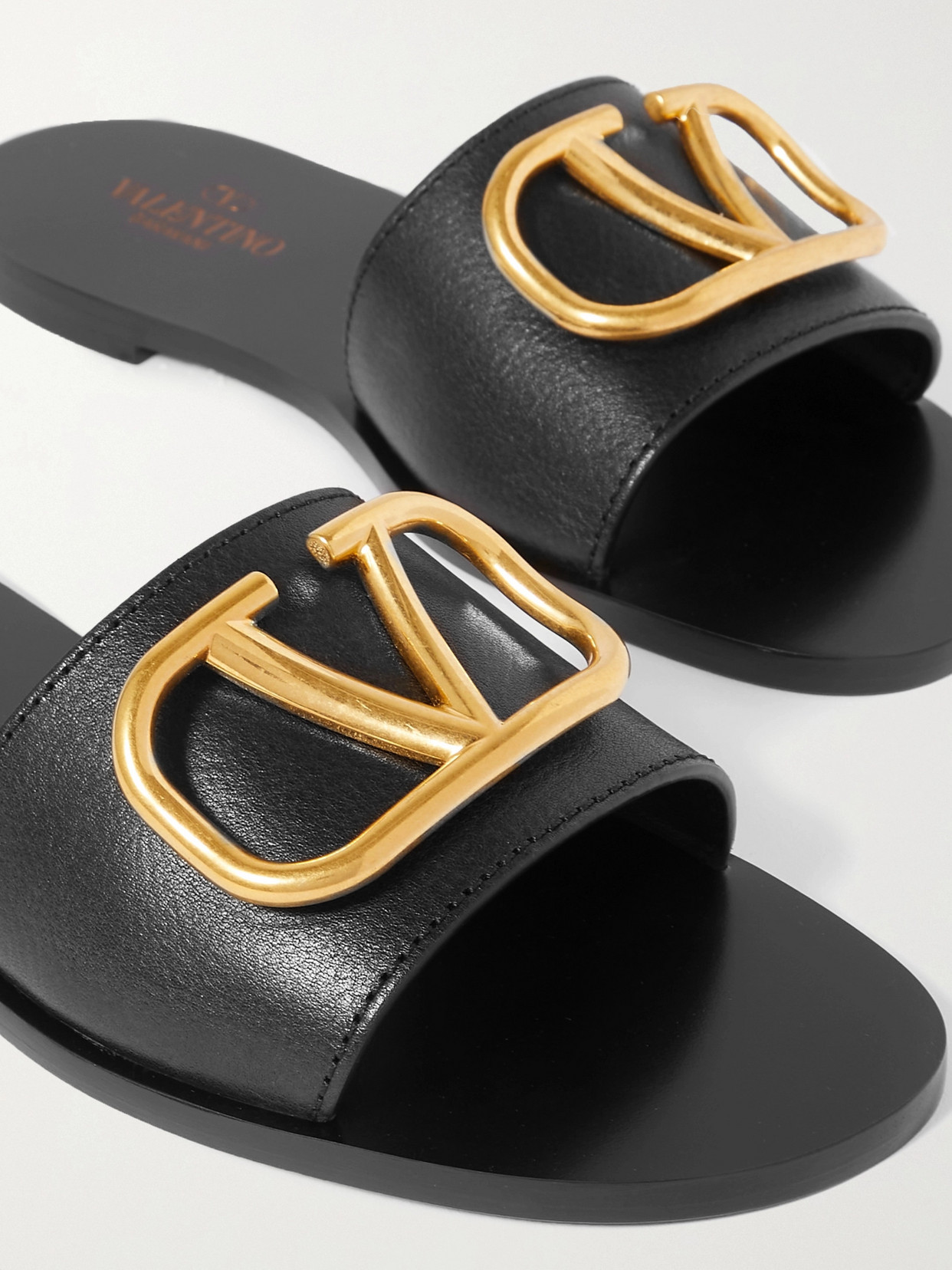 Shop Valentino Garavani Vlogo Textured-leather Slides In Black