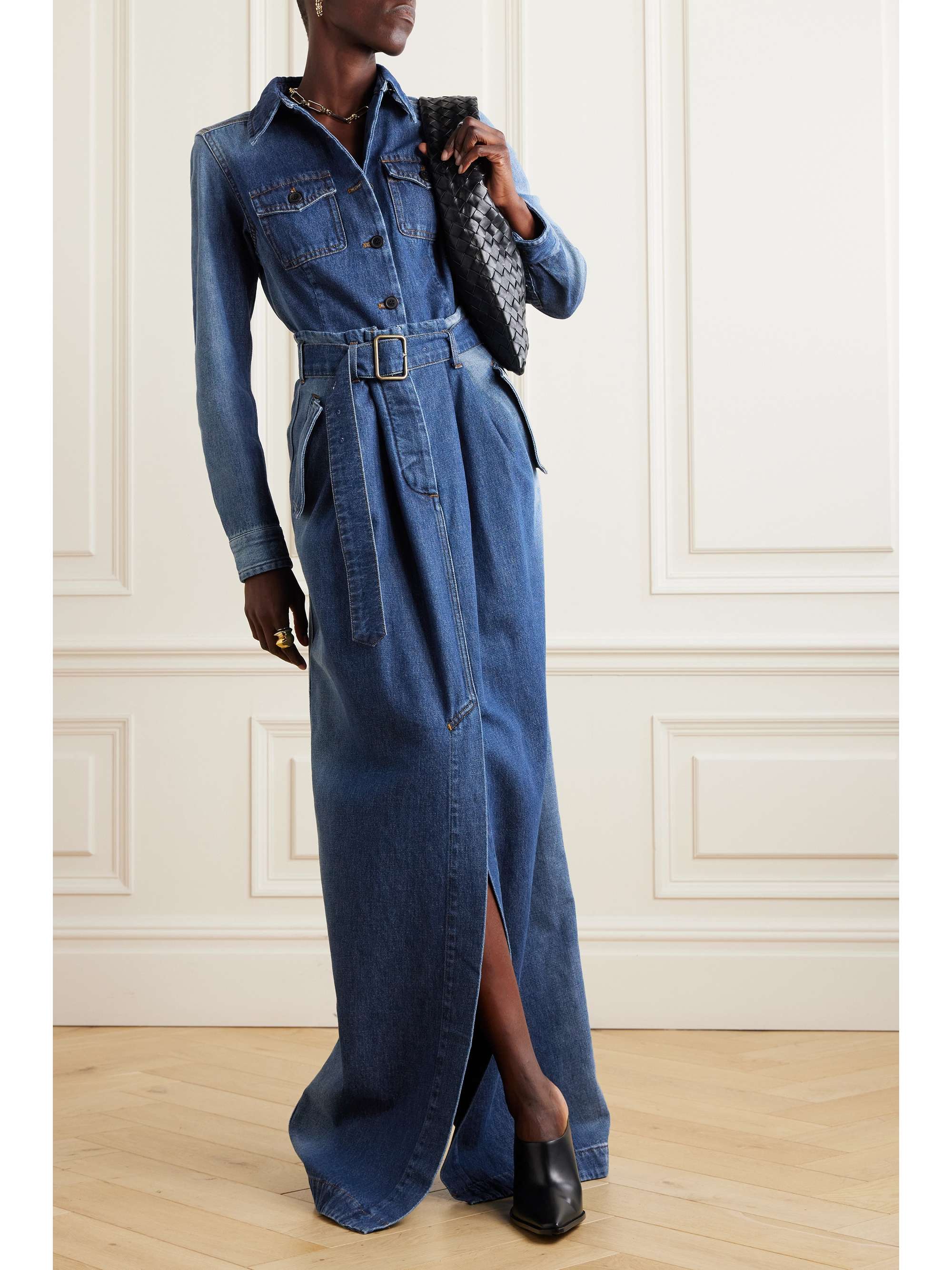 Dries Van Noten's contemporary eye elevates the denim skirt into something that transcends seasons and trends. Cut for a relaxed shape, it has a paperbag waist and a wide belt that exaggerates the shape. Lift the floor-sweeping hem with heels.
