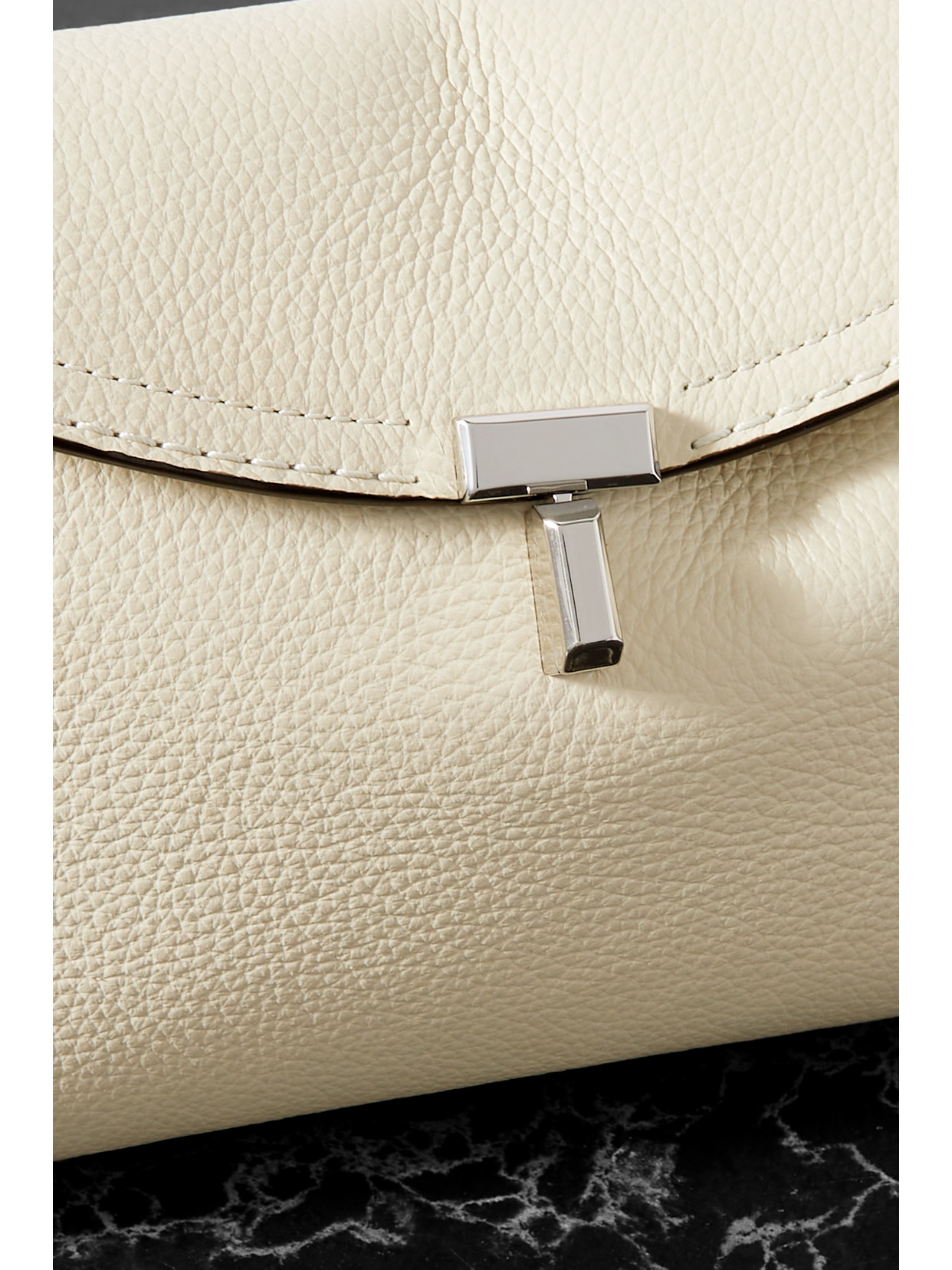 Shop Totême T-lock Textured-leather Clutch In Off-white