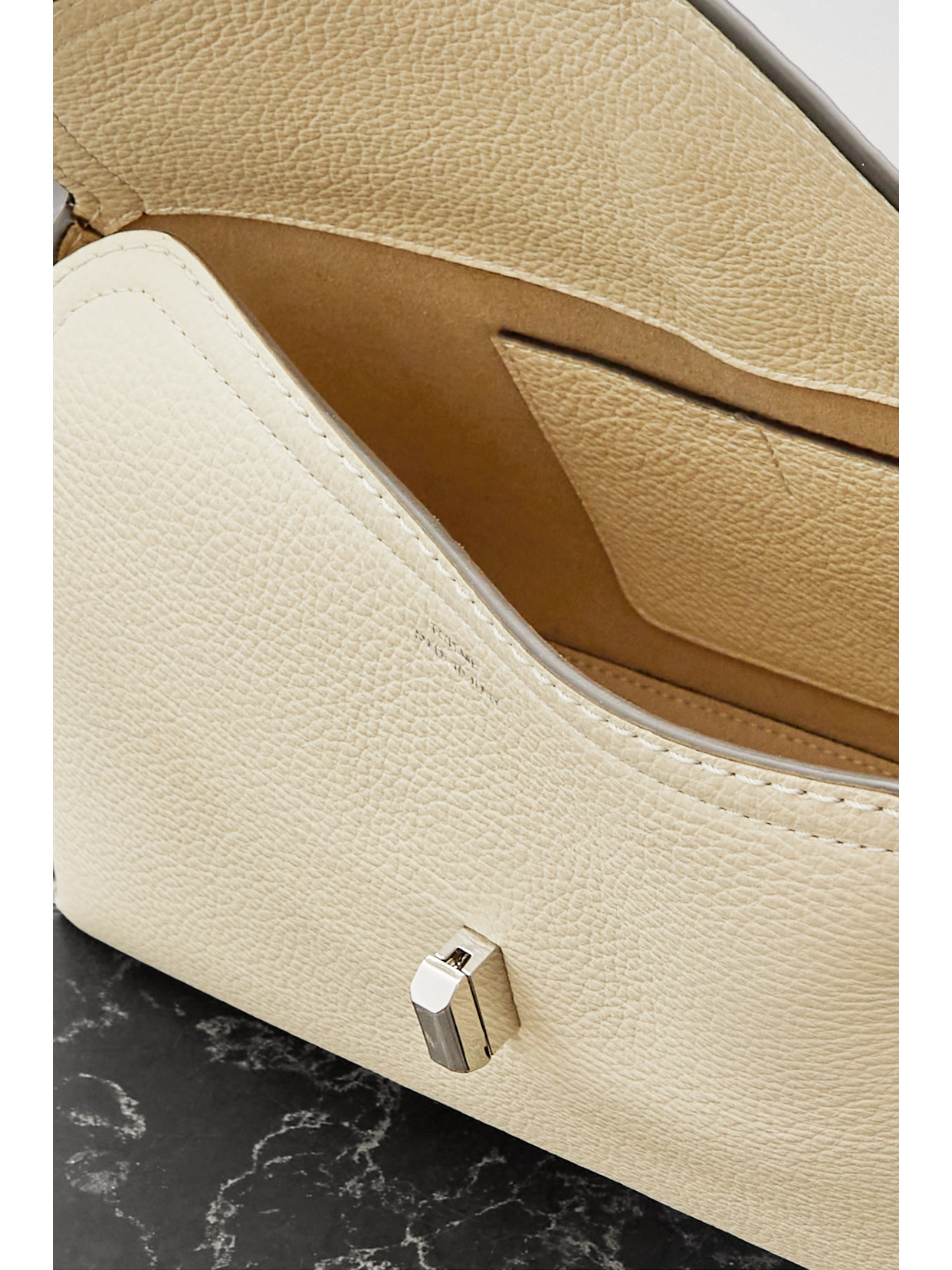 Shop Totême T-lock Textured-leather Clutch In Off-white