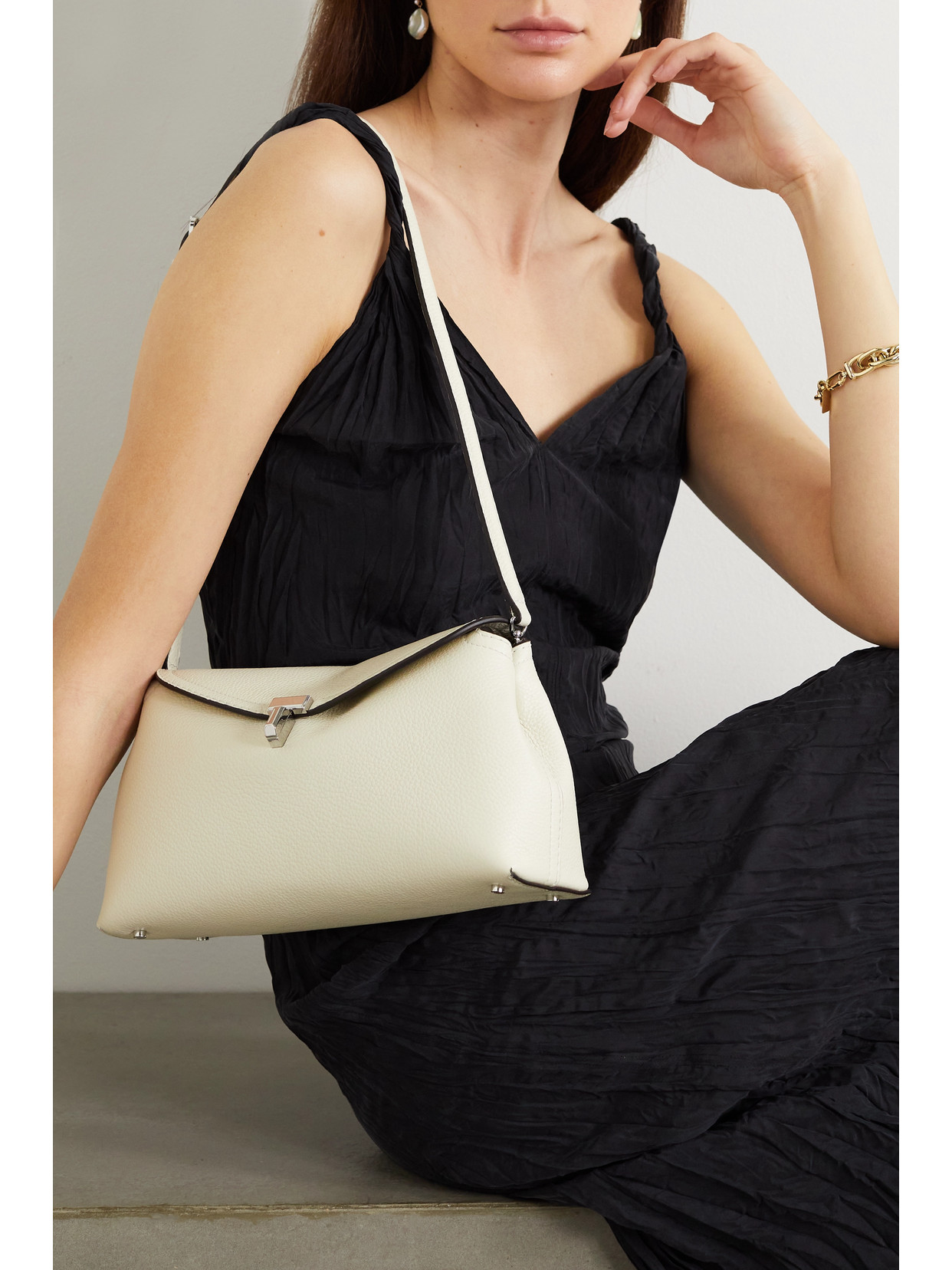 Totême T-lock Textured-leather Clutch In Off-white