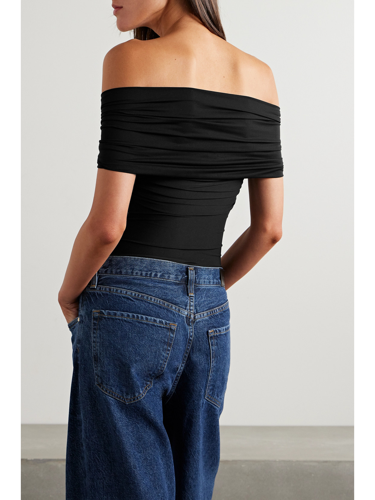 Goldsign The Odette Off-the-shoulder Twist-front Ruched Stretch-jersey Thong Bodysuit In Black