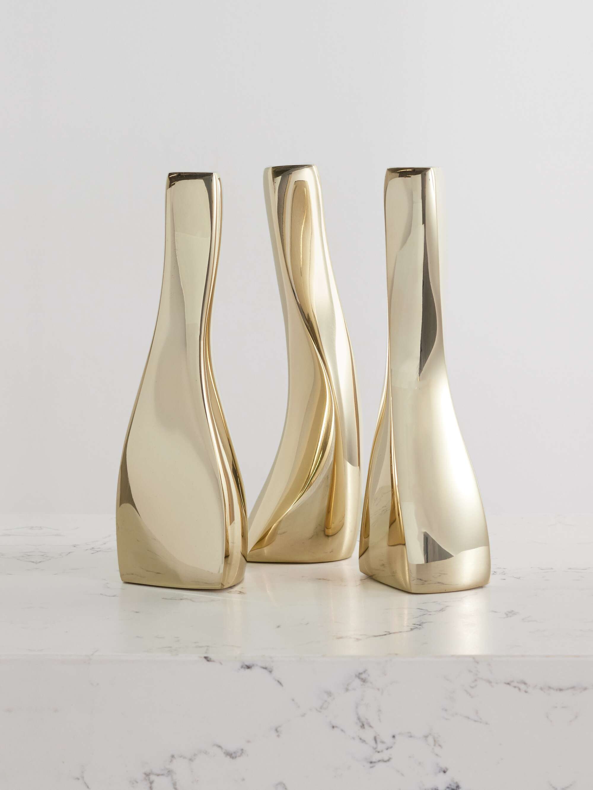 Fourth Season Set of three gold-tone candlesticks