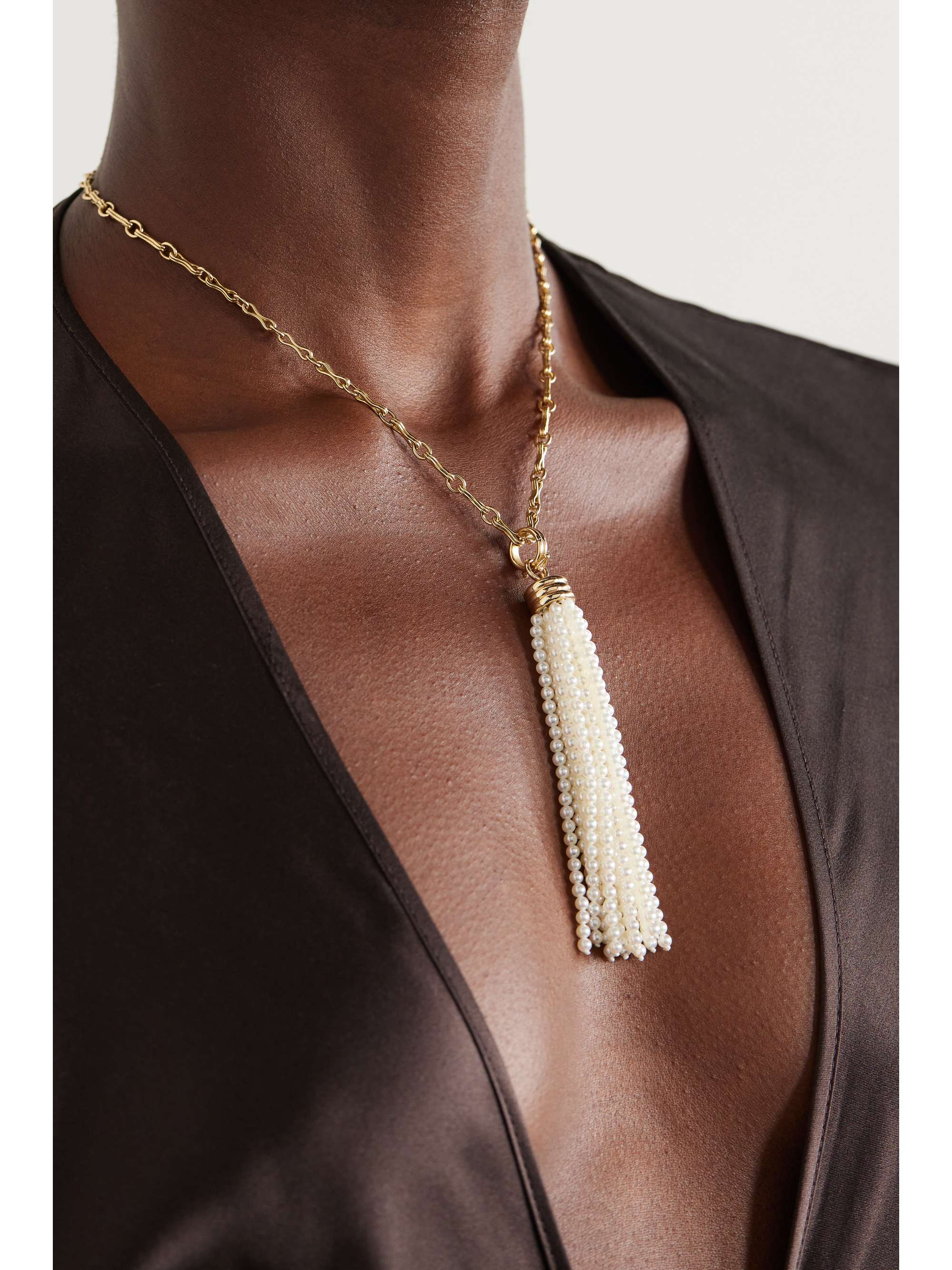 Gold pendant on sale with tassel