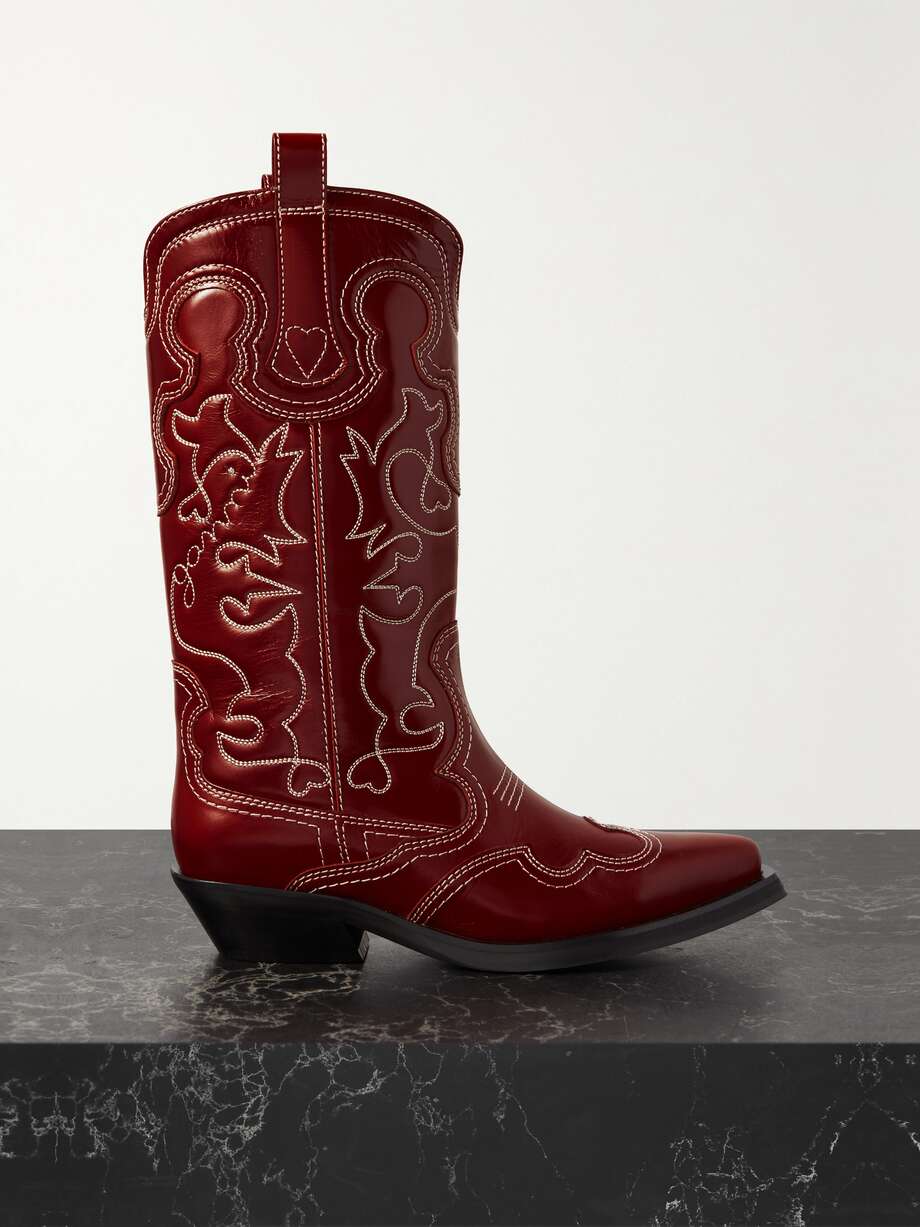 GANNI's signature cowboy boots have long been a hallmark of the Scandi brand. This pair has been crafted in Portugal from leather with swirling topstitching and rest on a stacked Cuban heel.