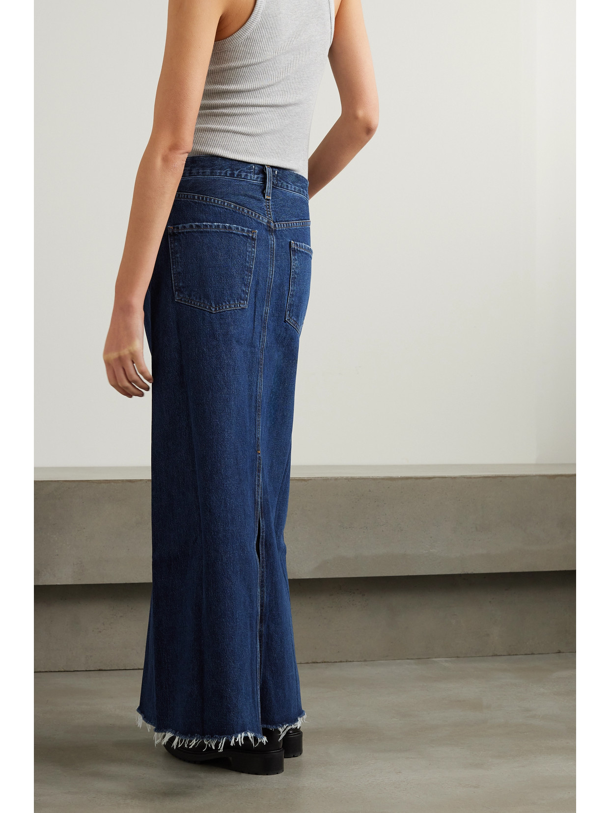 Shop Agolde + Net Sustain Hilla Frayed Organic Denim Maxi Skirt In Indigo