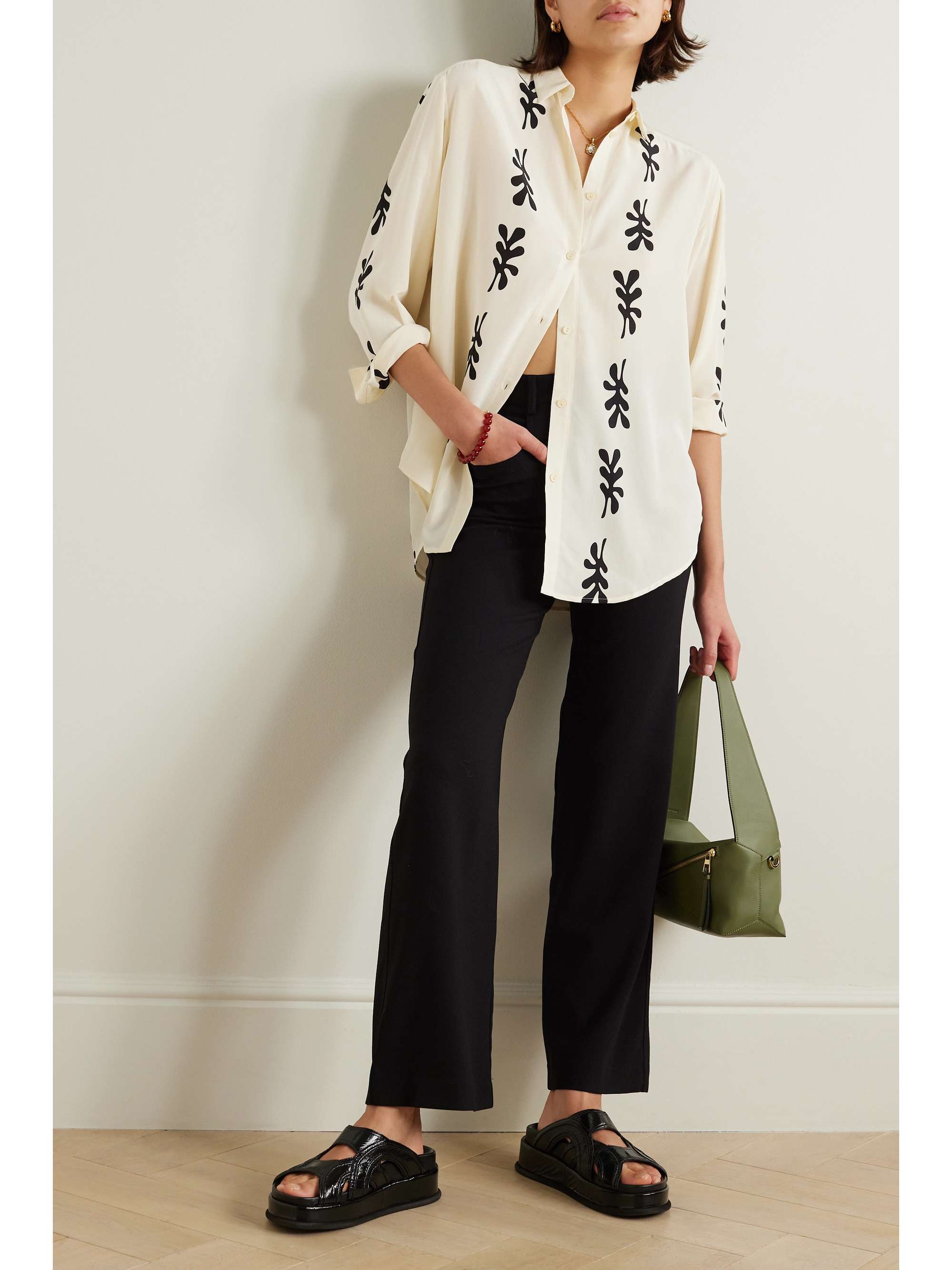MATTEAU + NET SUSTAIN printed organic silk shirt Spun from certified organic silk, this shirt is printed with artful fig leaves and has a slightly loose, breezy shape enhanced by side slits. Roll up the sleeves for a more relaxed take.