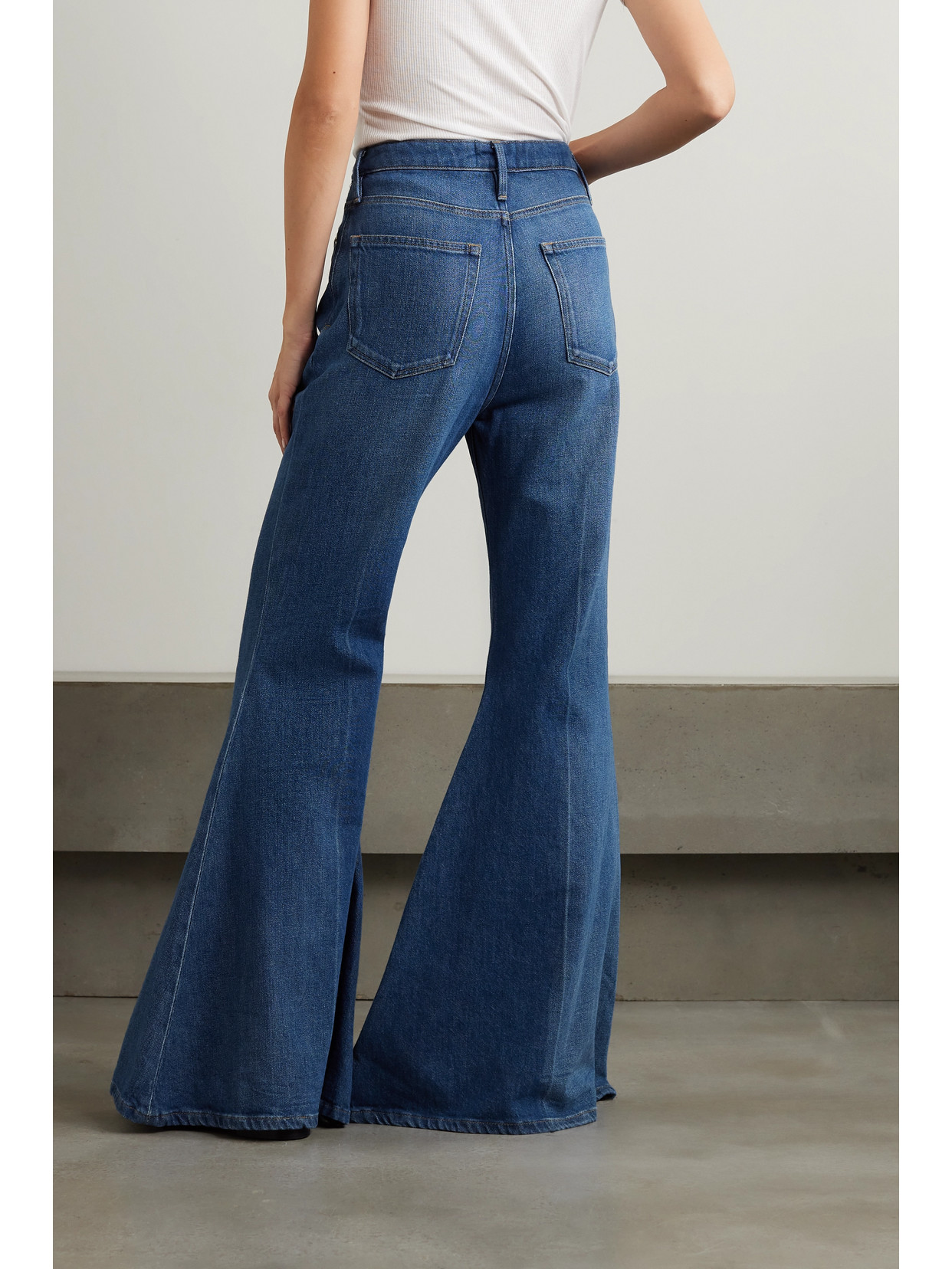 Shop Frame + Net Sustain The Extreme High-rise Flared Jeans In Blue