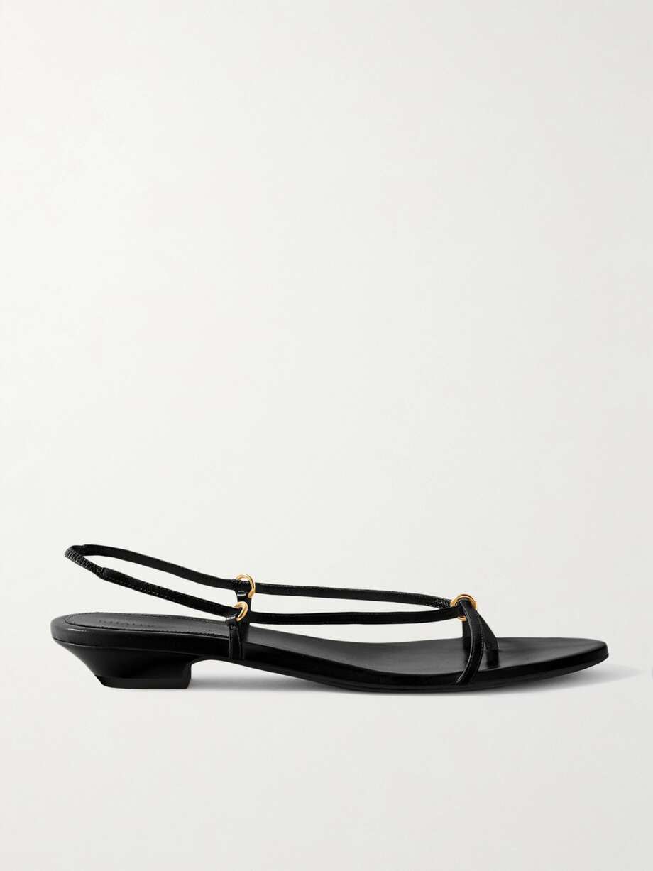 Khaite's 'Marion' sandals are modern and minimal, so they'll look cool with nearly anything from dresses to tailoring. Set on slanted 15mm heels, they're made with slim leather straps that thread through gold-tone rings and beautifully frame your foot.