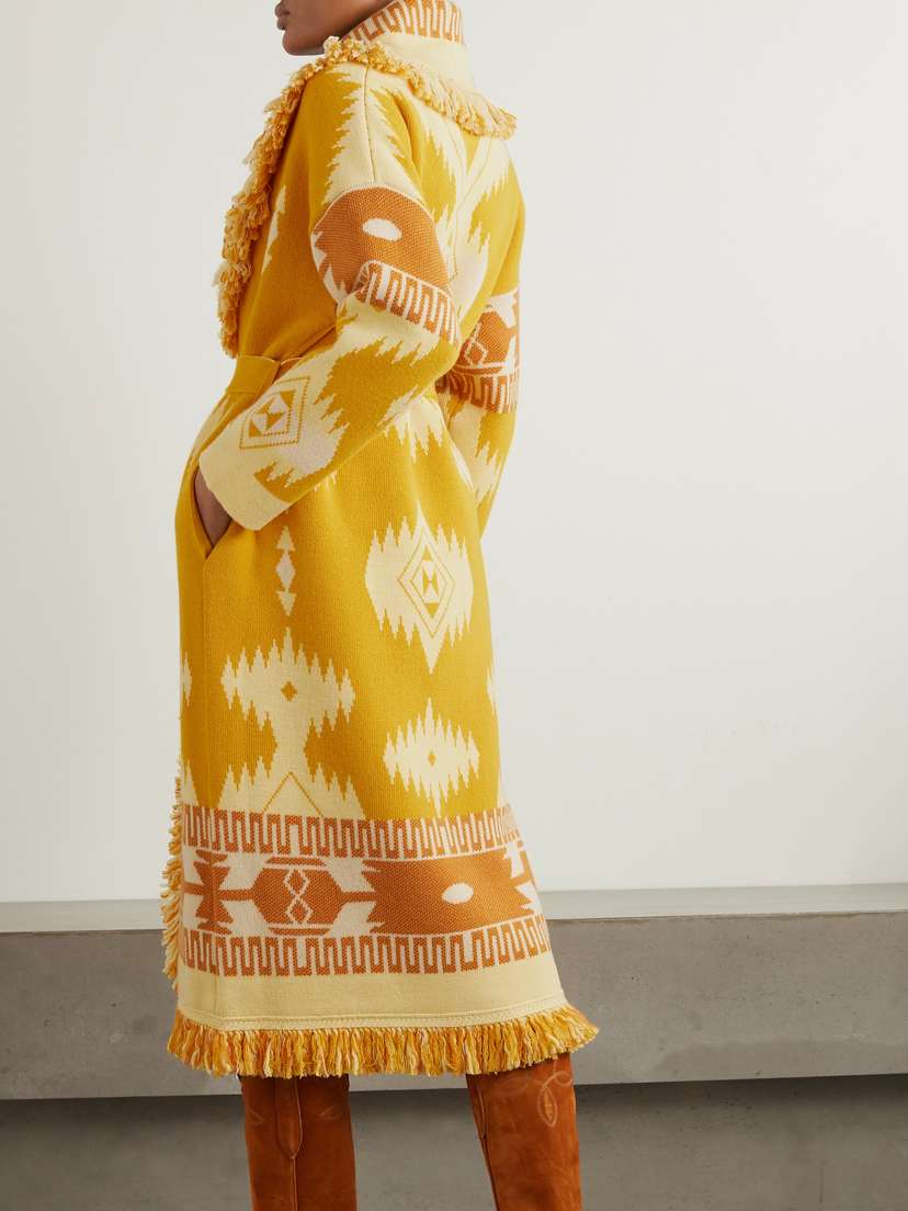 Alanui Icon Belted Fringed Wool Jacquard-knit Cardigan - side view in Yellow