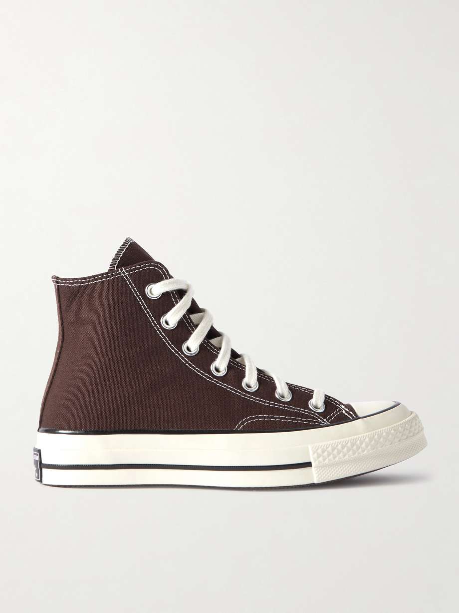 Converse's 'Chuck 70' sneakers have the same iconic high-top shape that’s synonymous with the label, but are updated with a more durable canvas upper and cushioned insole for comfort. This brown pair is finished with contrasting stitching and a vintage 'license plate' plaque at the heel. Wear them with jeans and dresses alike.