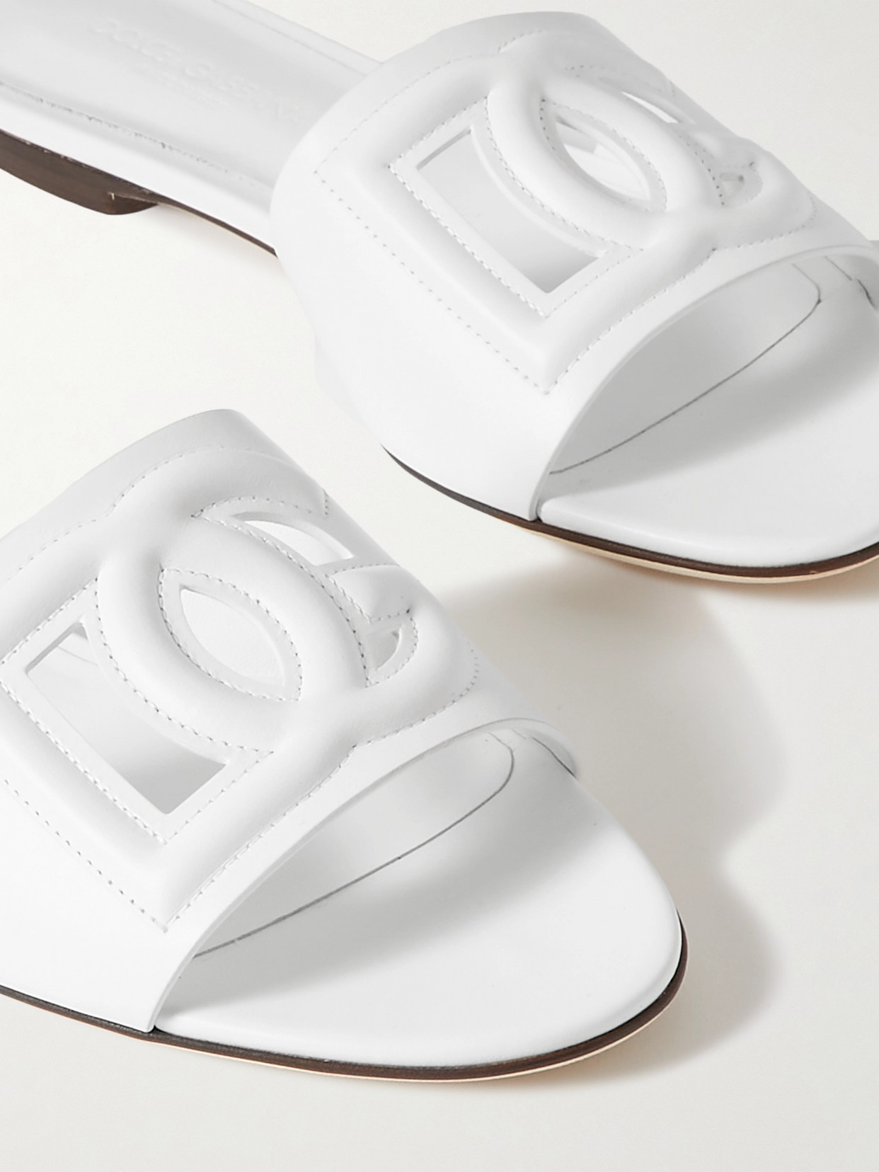 Shop Dolce & Gabbana Bianca Cutout Leather Slides In White