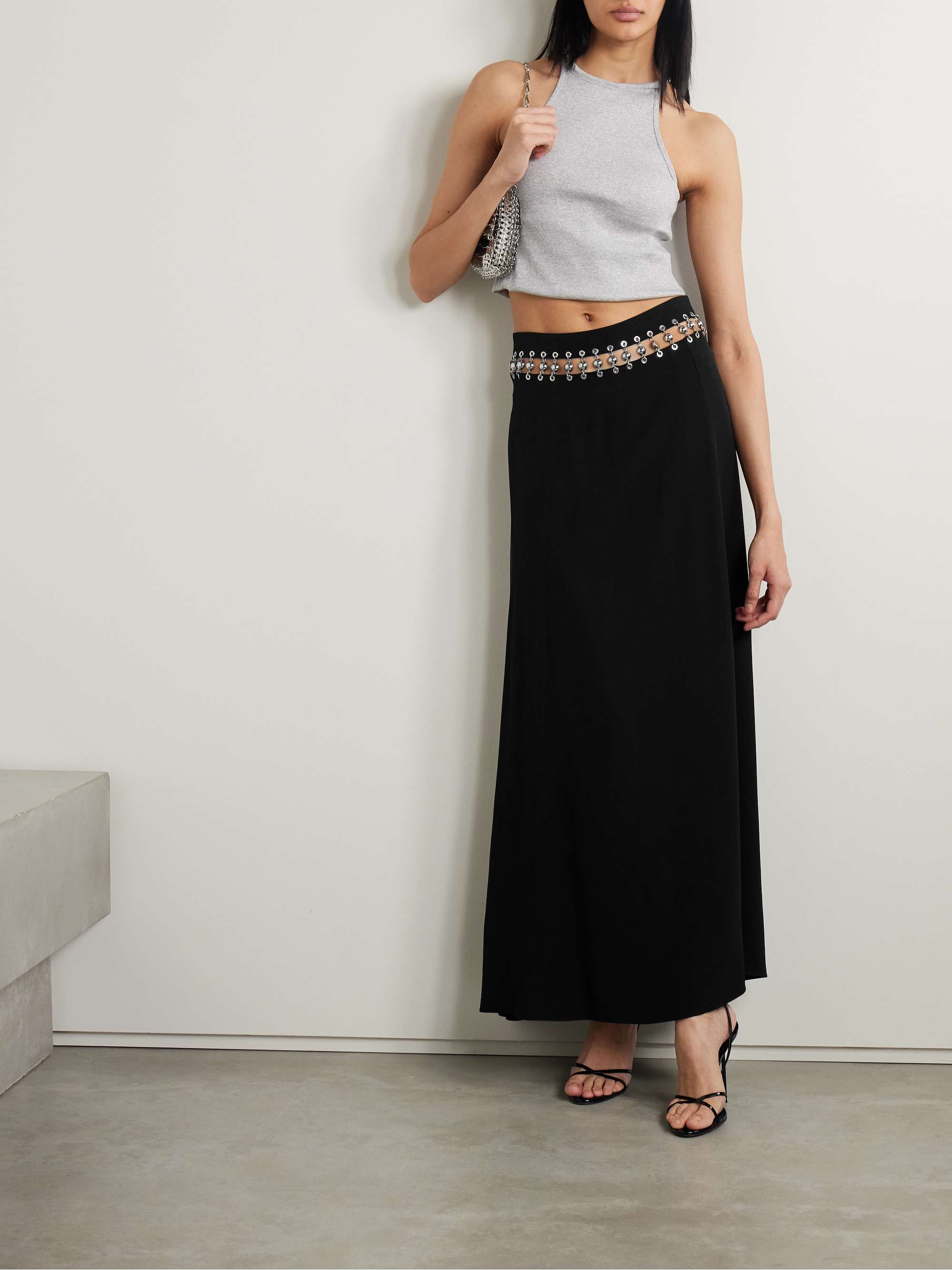 Julien Dossena's experimental approach to design comes through in the embellished cutout of Rabanne's maxi skirt - the silver-tone ball and chain hardware is threaded through eyelets and creates a punk-inspired effect. It's made from smooth cady and has a dramatic back split. Wear yours with a cropped top to show off the details.