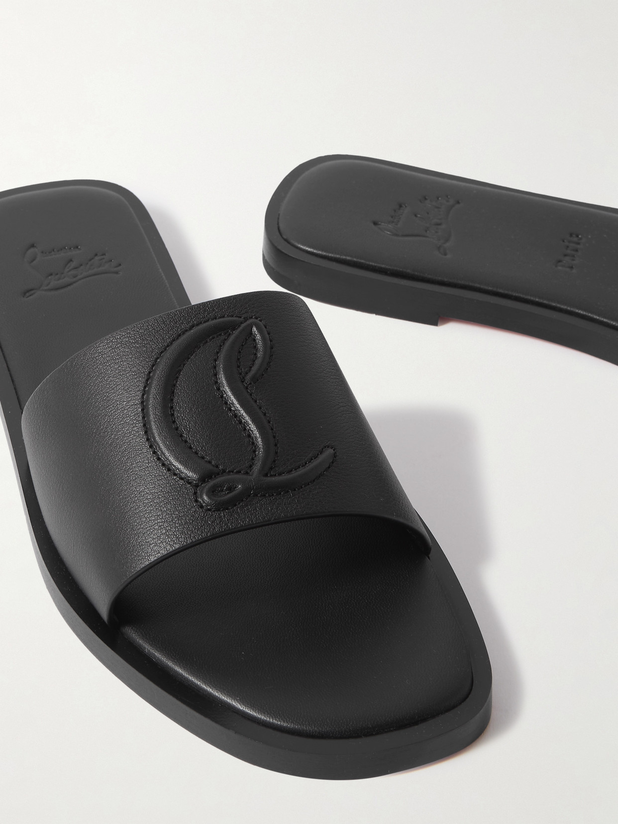 Shop Christian Louboutin Cl Logo-embossed Leather Slides In Black