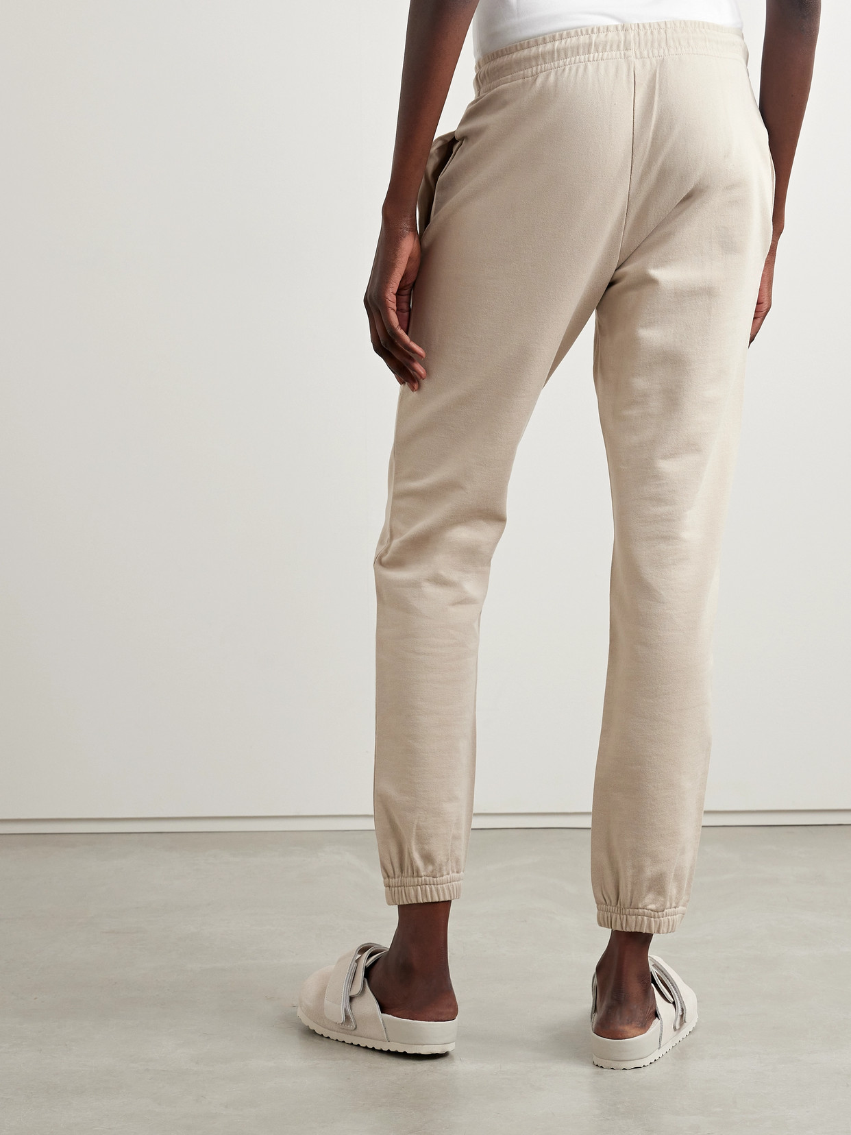 Shop Moncler Appliquéd Cotton-jersey Tapered Track Pants In Neutrals