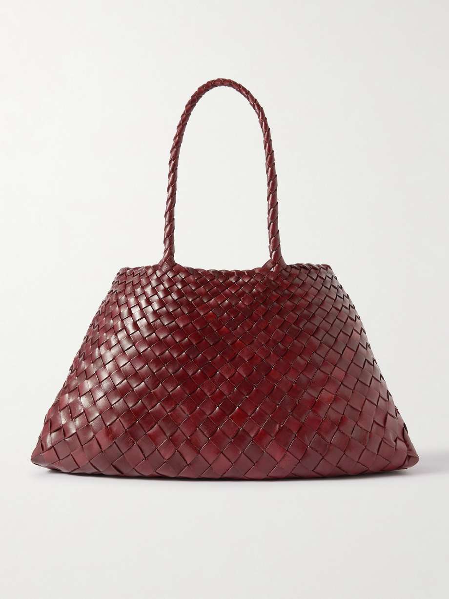 summer basket bags 2024 - Dragon Diffusion's bags are inspired by traditional woven baskets used for hundreds of years around the world. This 'Santa Croce' tote is handmade from vegetable-dyed strips of leather that get thinner towards the top to achieve the elegantly curved trapeze shape. Inside you'll find a hand-sewn St. Christopher medal charm, believed to manifest protection on your travels and the brand's marker of quality and authenticity.
