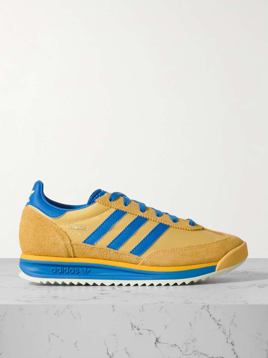 adidas Originals' sneakers are modeled on the brand's retro style from 1972 - hence the number in the name. Made from durable mesh, this low-top pair is framed with tonal suede and features contrasting blue leather as the instantly recognizable '3-Stripes' and on heel tab. They have serrated rubber soles that add a pop of color and incredible support.