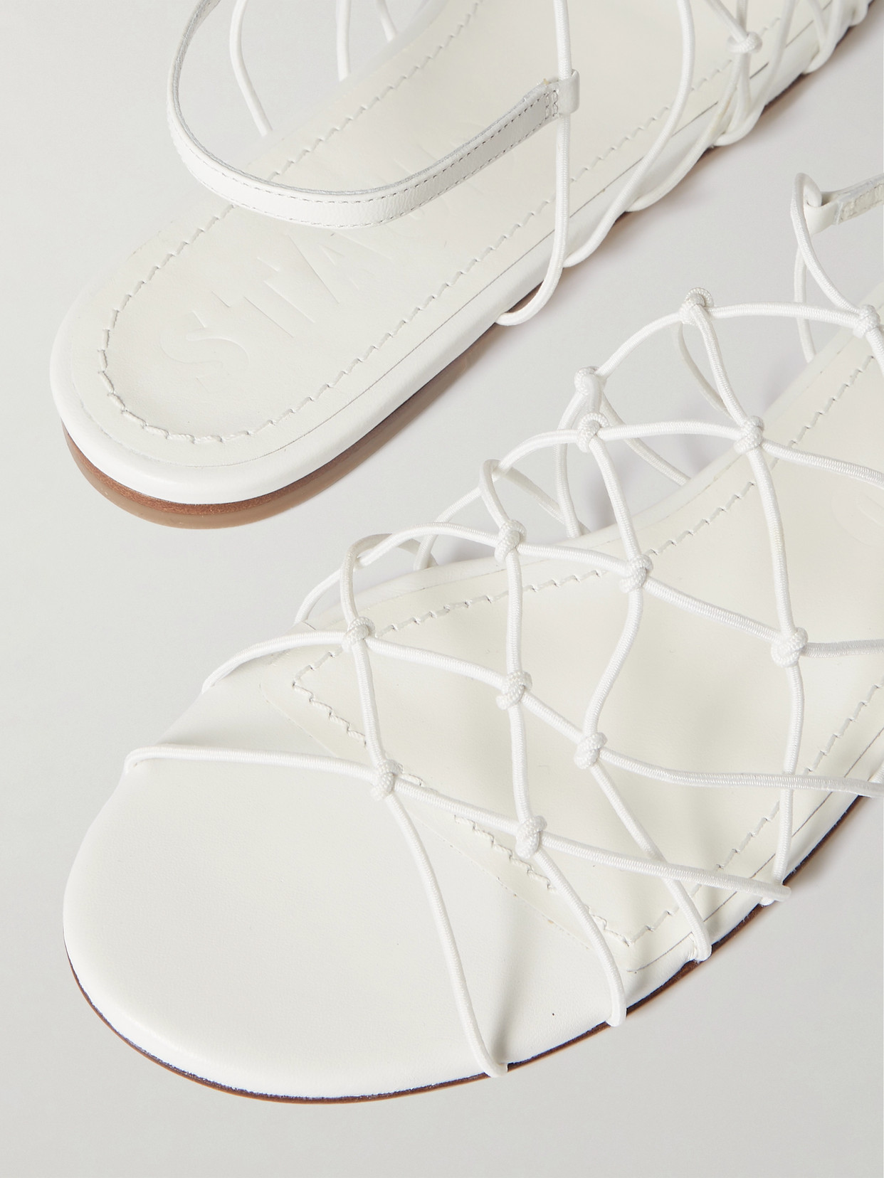 Shop Staud Gio Knotted Elastic And Leather Sandals In White