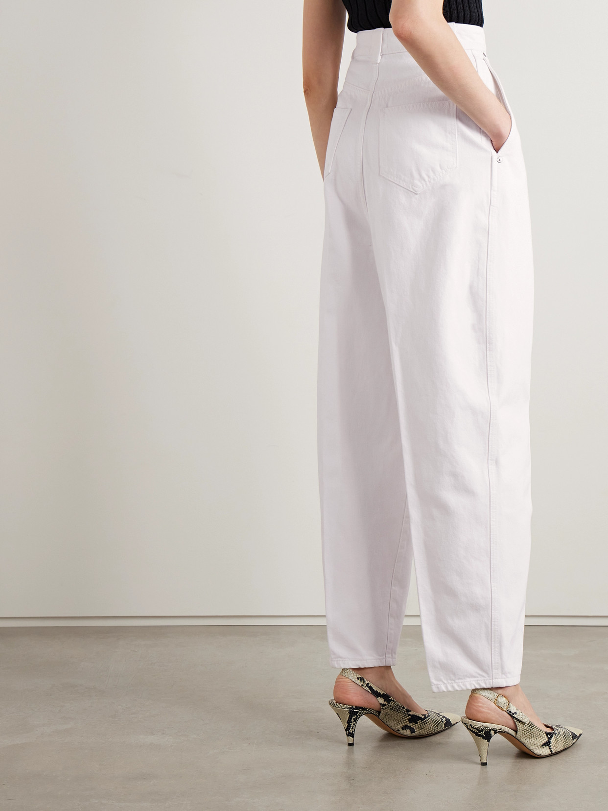 Khaite Ashford Pleated High-rise Tapered Jeans In White
