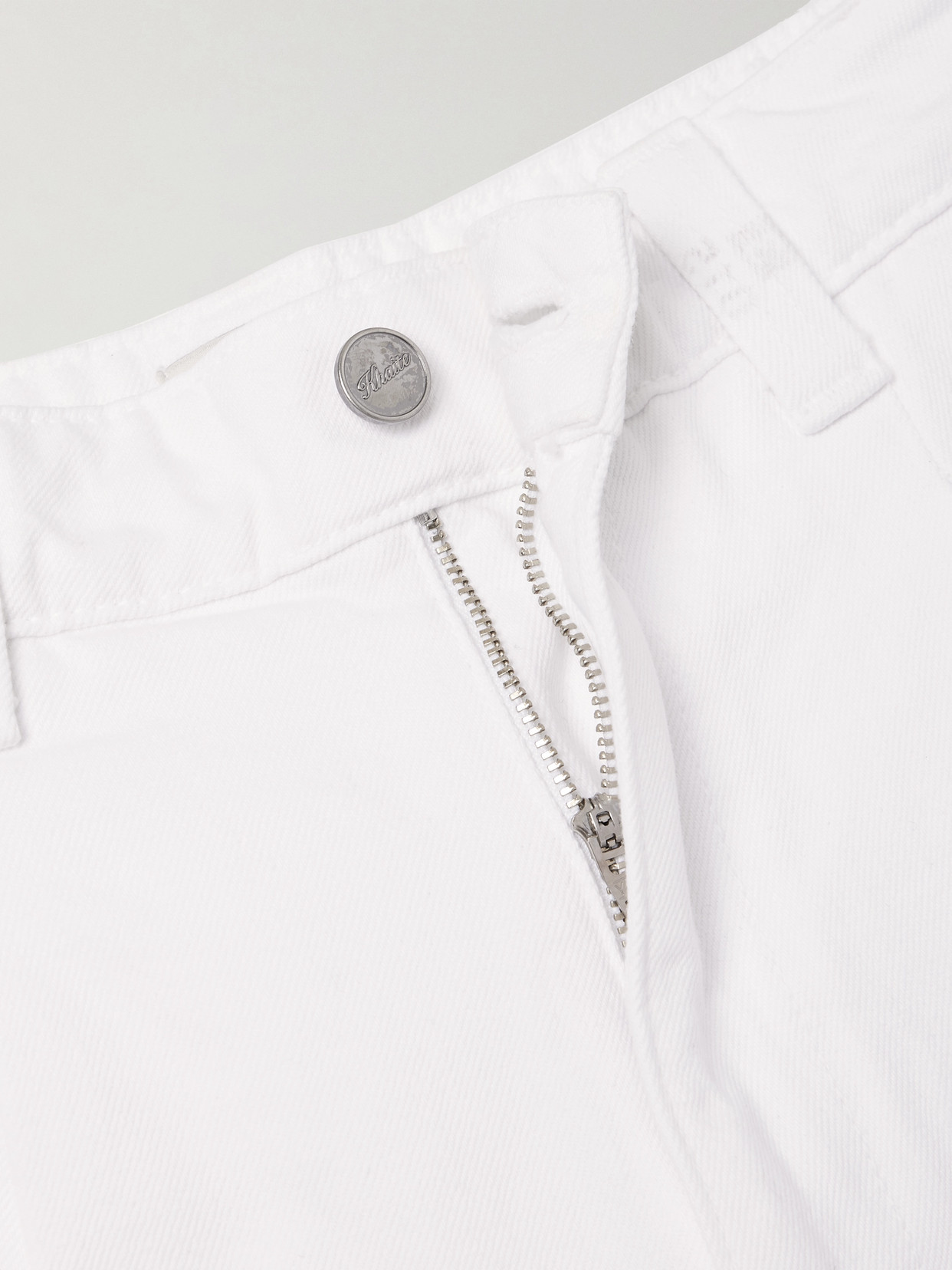 Khaite Ashford Pleated High-rise Tapered Jeans In White