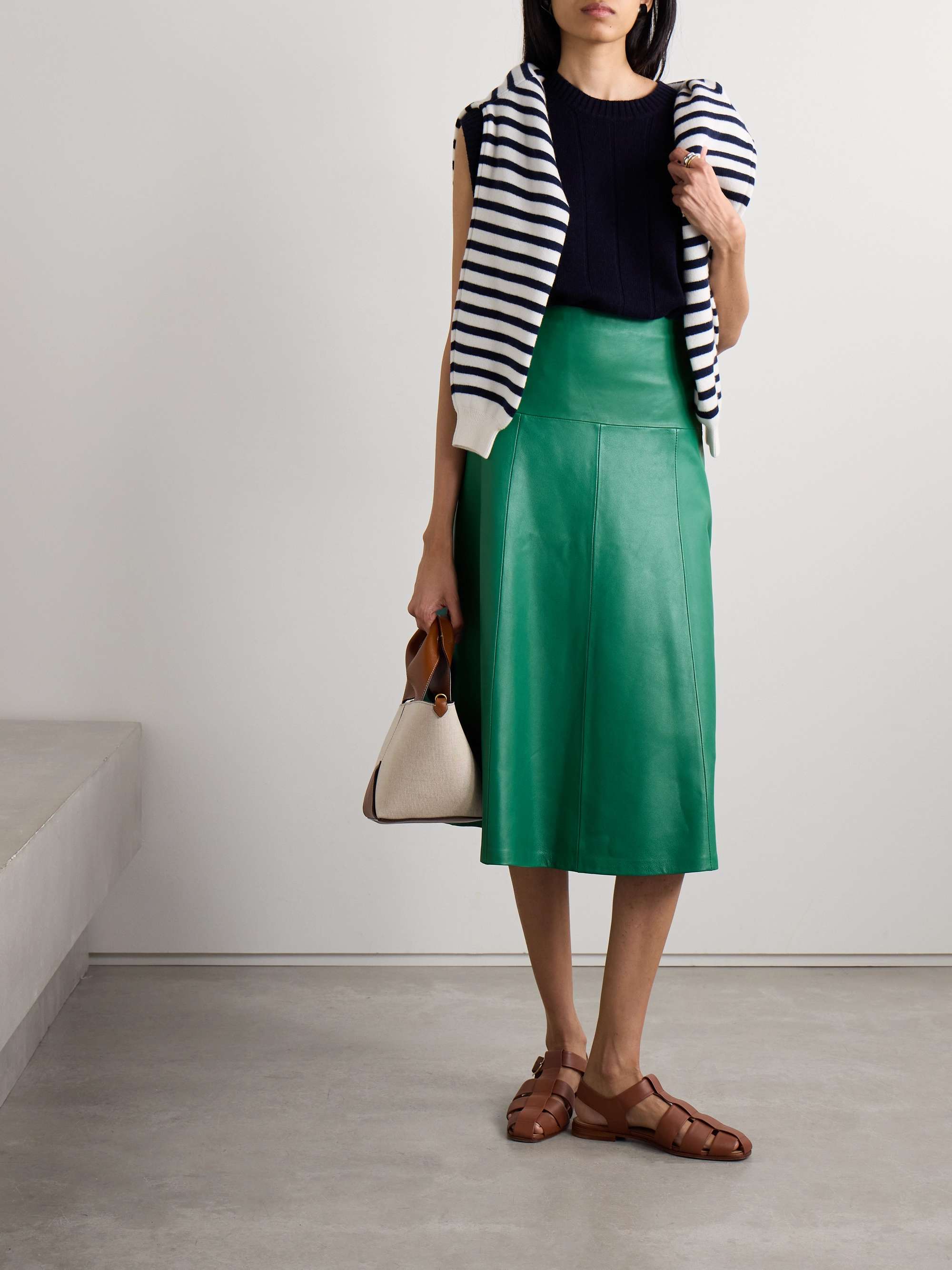 Perfect for busy lifestyles, Cefinn's collections are designed to effortlessly take you from day to night. The 'Sierra' skirt is a best-seller, re-imagined in various fabrics and prints over the years - this one is paneled from supple emerald leather. Team yours with knee boots or sneakers.