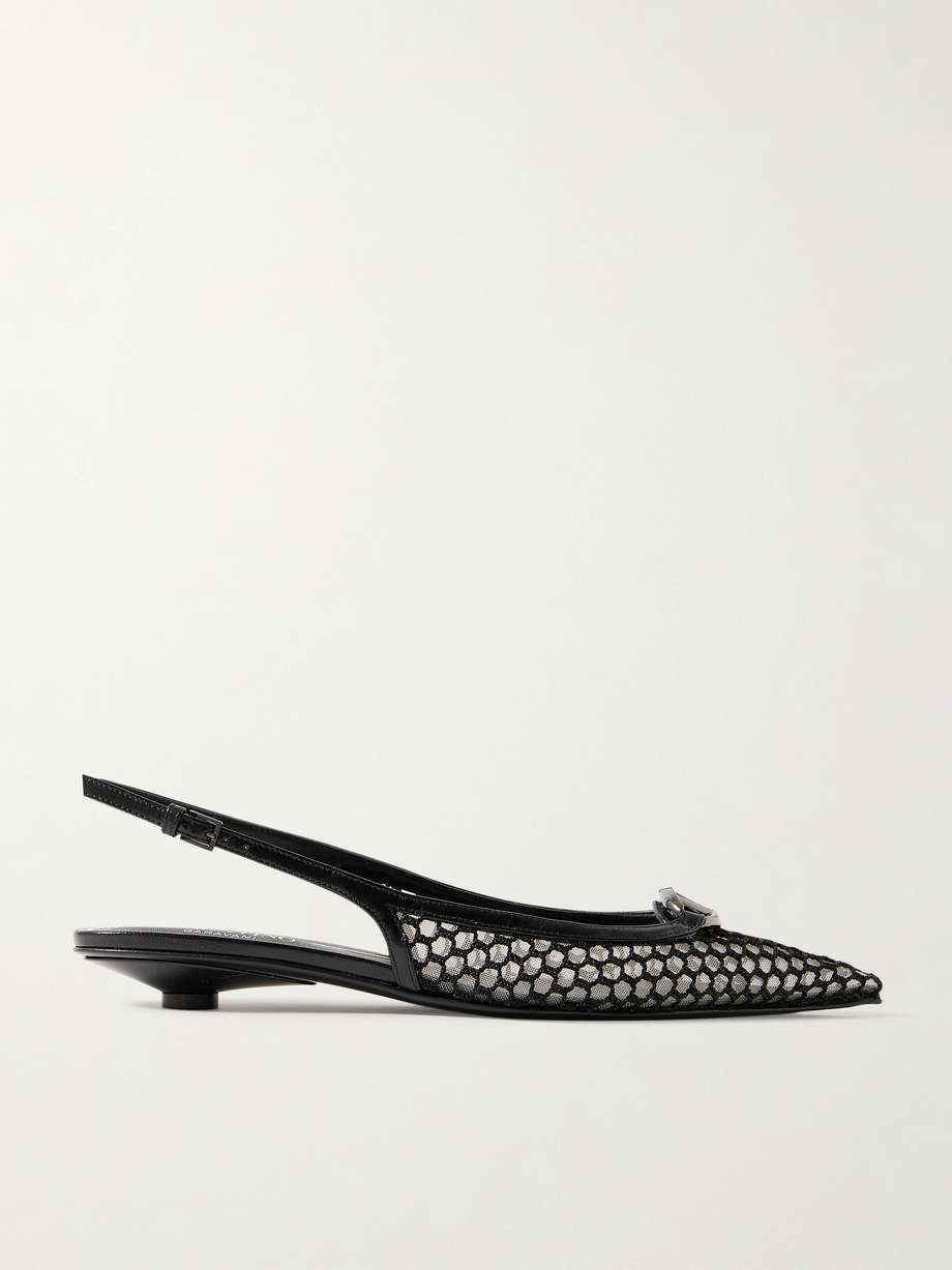 Valentino Garavani's ‘VLOGO Moon’ slingback pumps debuted on the Spring ’24 runway. Crafted from fishnet, they rest on wearable 20mm heels and have elongated pointed toes topped with polished metal logos. Wear yours with one of the intricate dresses from the collection.