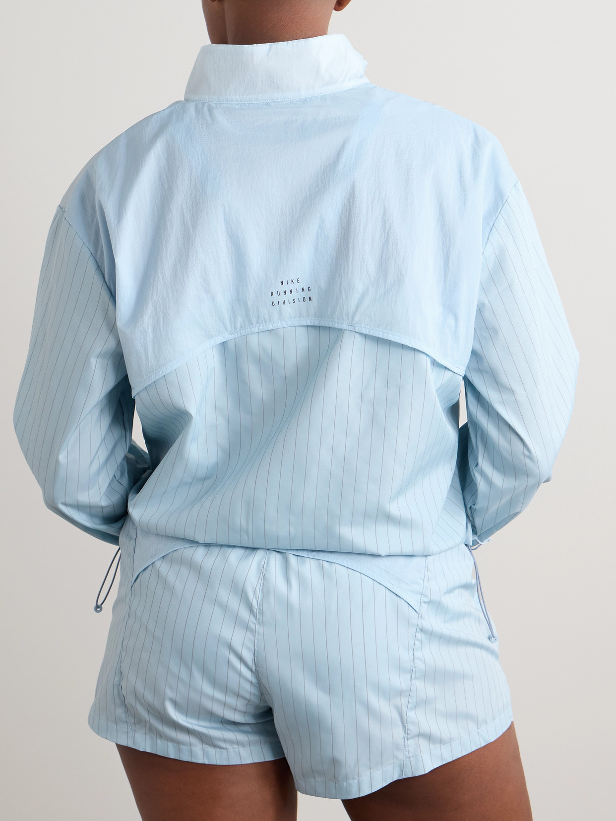 Nike Running Division Paneled Pinstriped Crinkled-shell Jacket In Blue