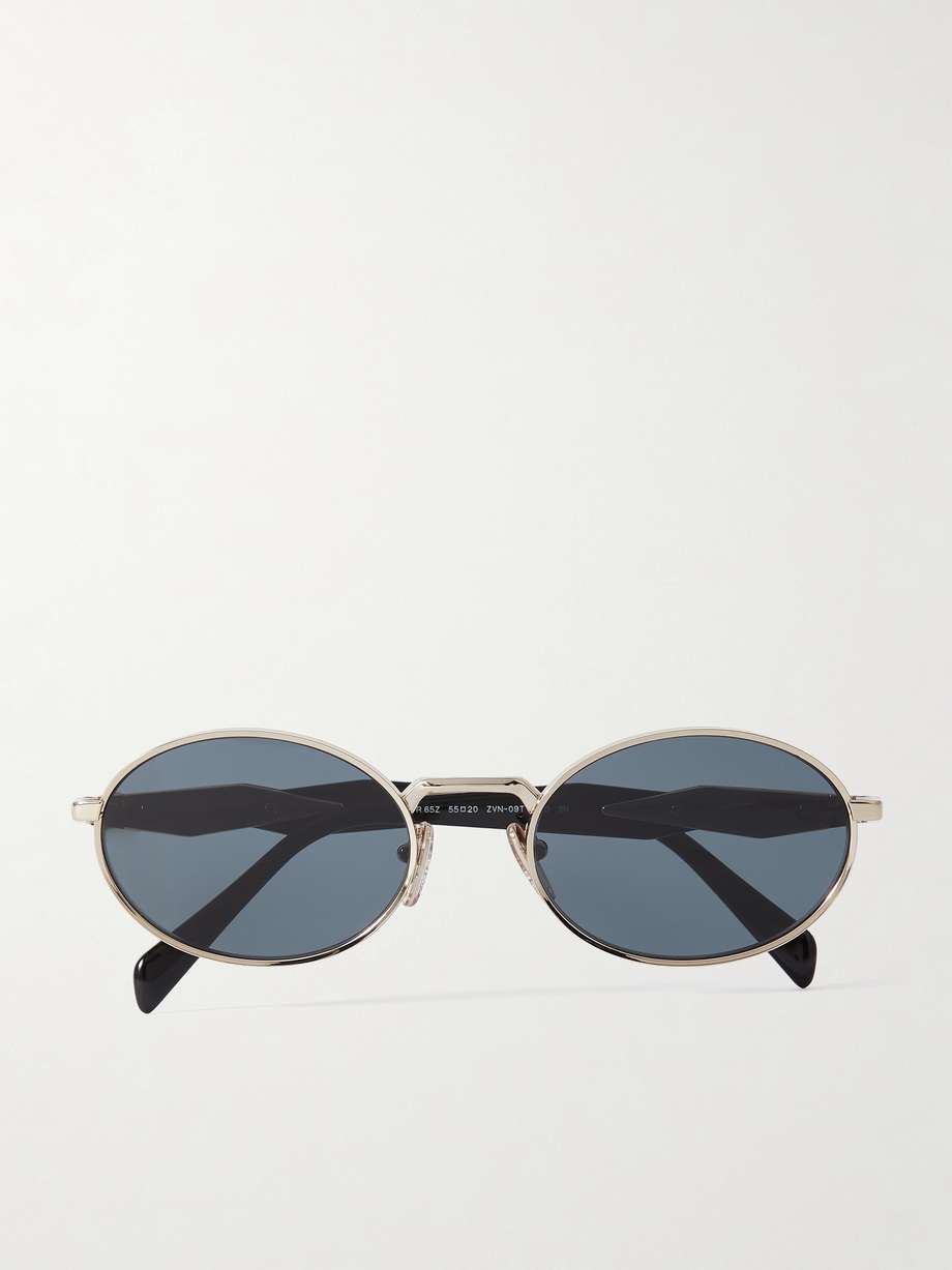 Prada Eyewear's sunglasses have oval frames reminiscent of styles from the '90s. They've been made in Italy from gold-tone metal and have angular arms that feature the house's moniker and comfortable acetate tips. Store them in the accompanying case to prevent scratches.