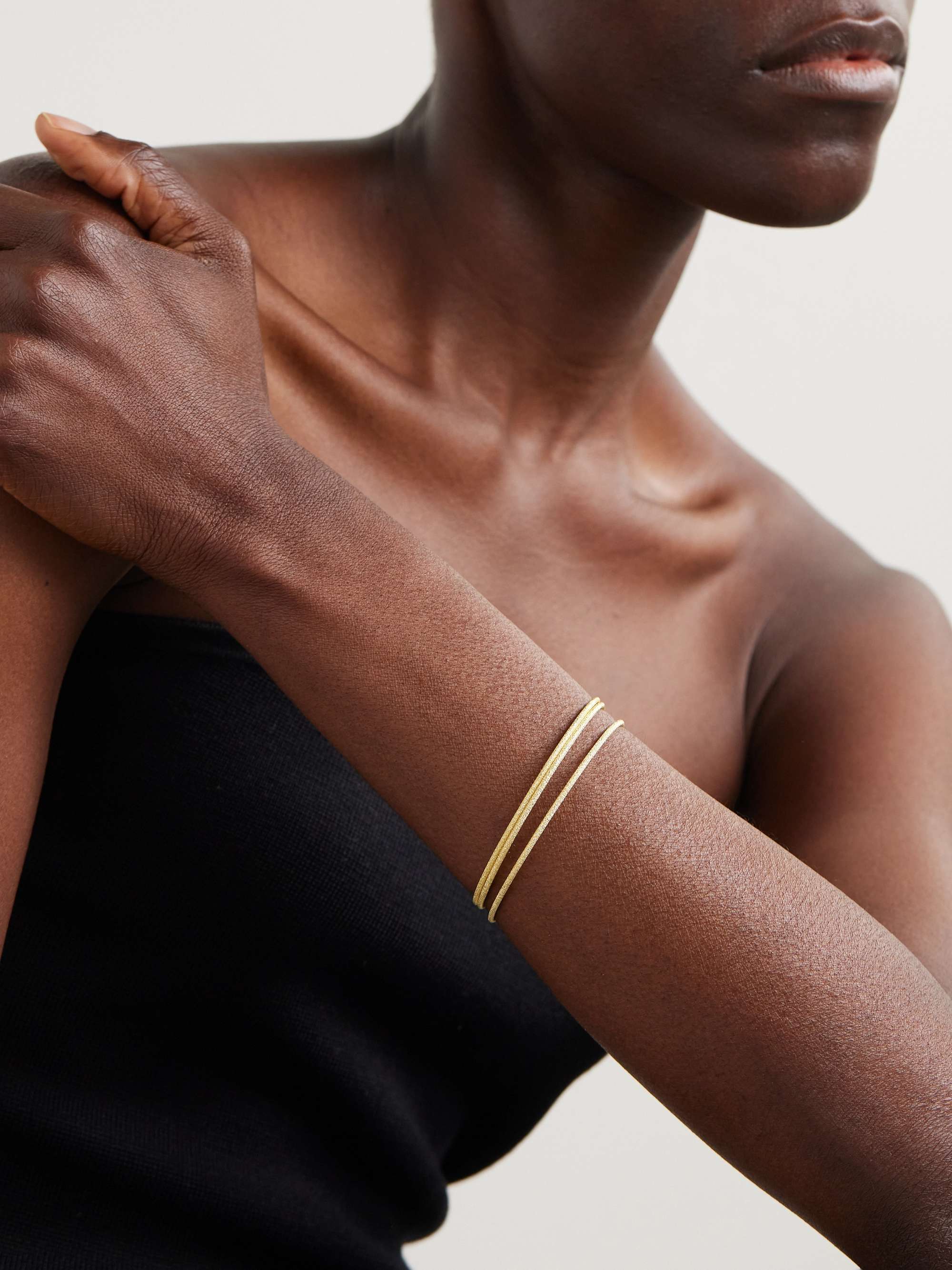 CAROLINA BUCCI Set of three 18 karat gold bracelets NET A PORTER