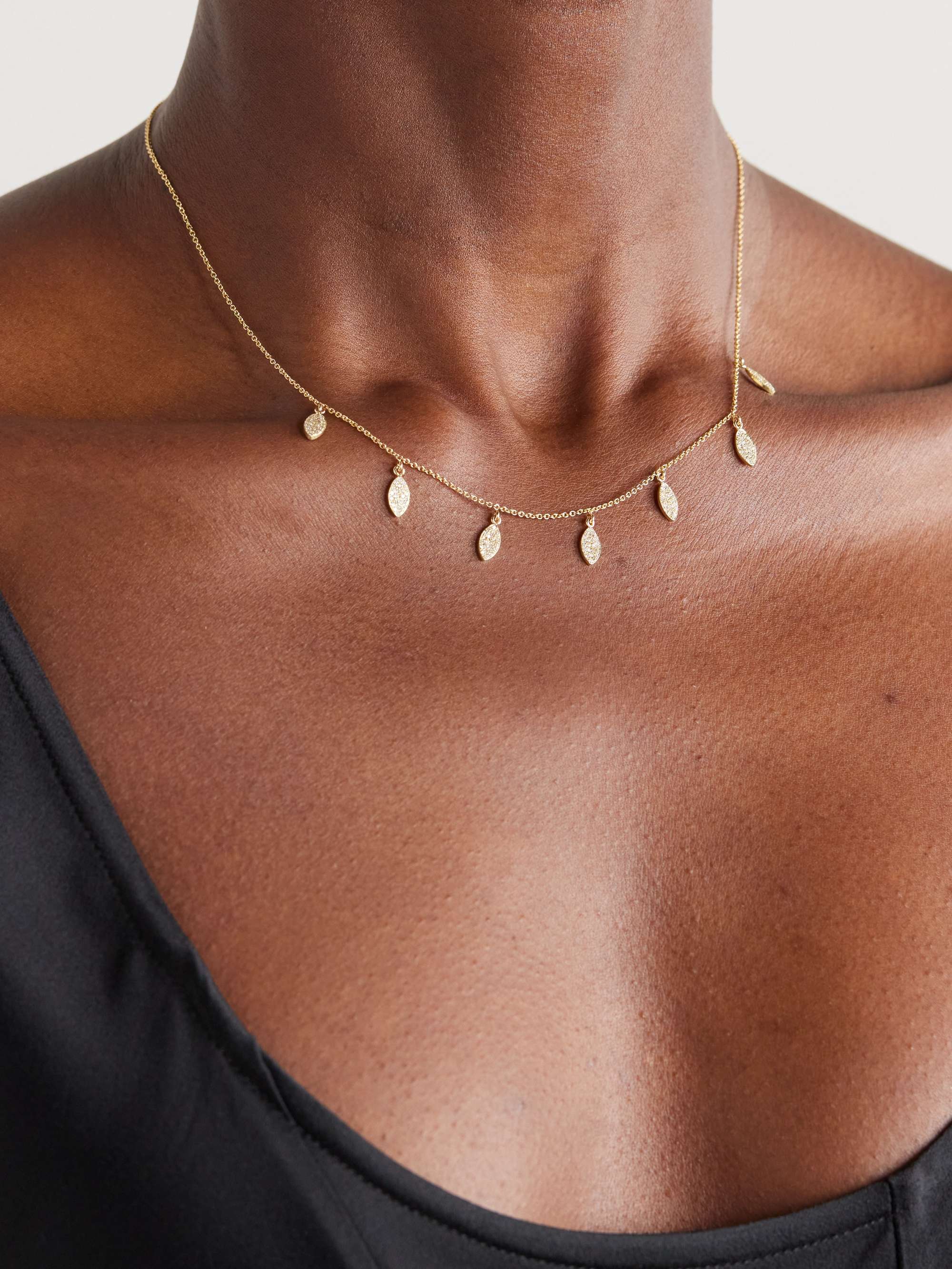 Gold necklace with dangles on sale