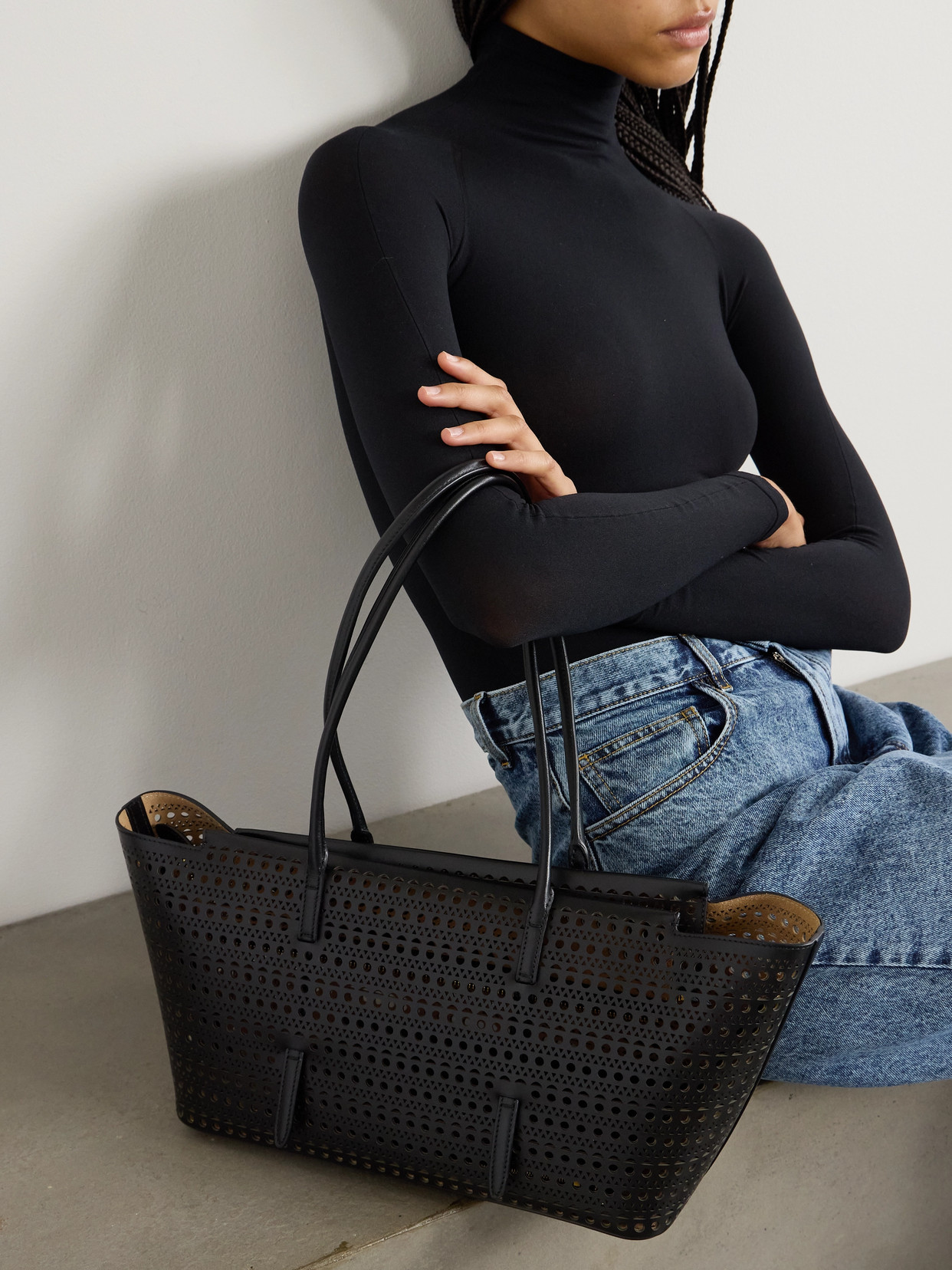 Alaïa Neo Mina 20 Perforated Top-handle Bag In Leather In Black
