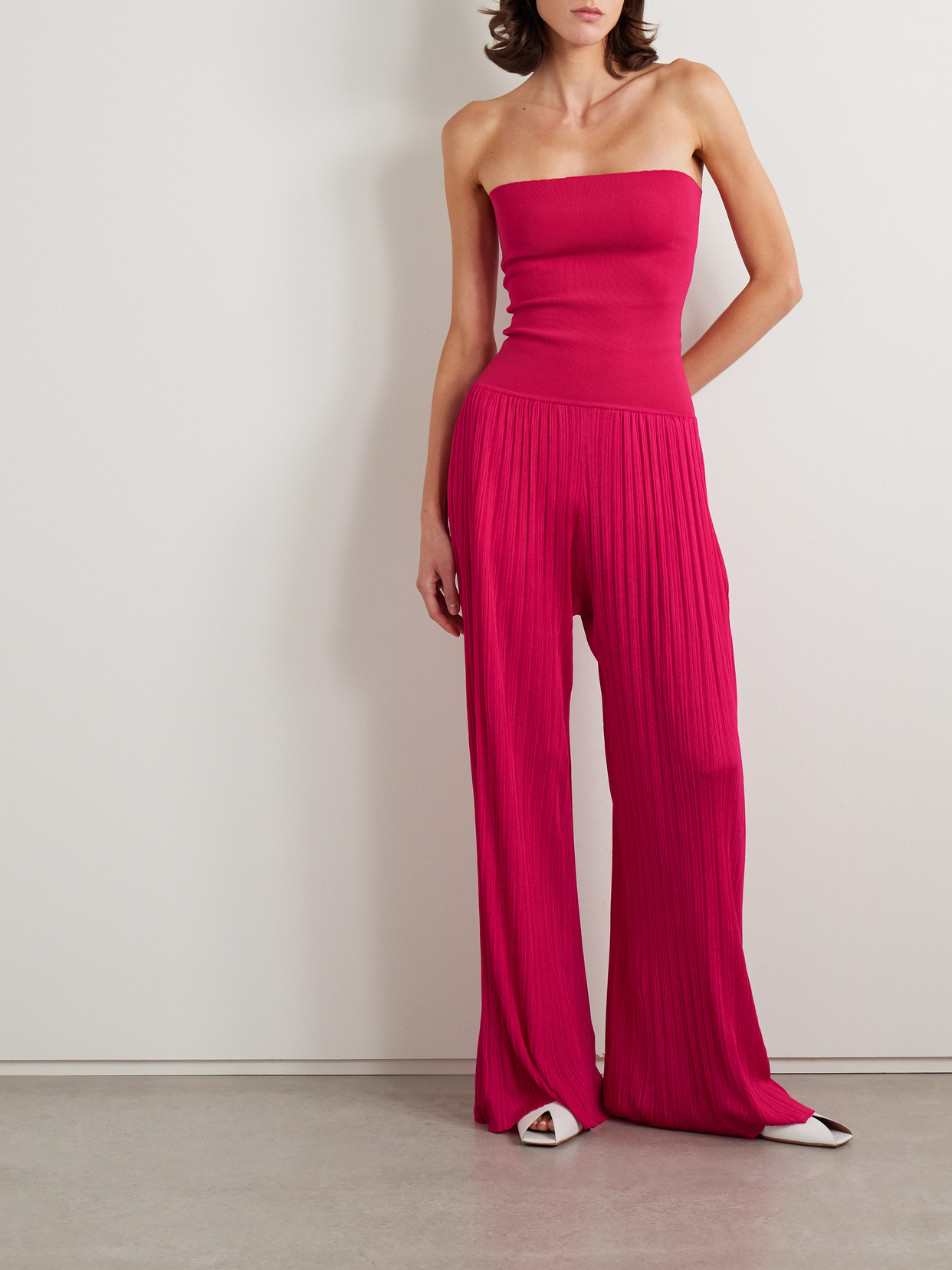 Alaïa Pleated Knitted Strapless Jumpsuit In Pink