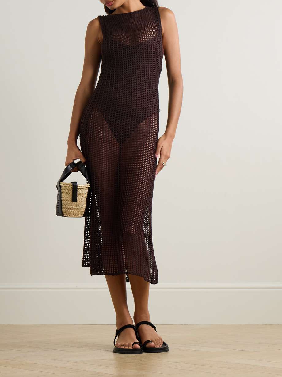 The open-knit stitching of Haight's 'Luciana' dress makes it great for slipping on over a bikini when heading to and from the beach. It's knitted in a relaxed column silhouette that's comfortable and chic with a slit for easy movement.