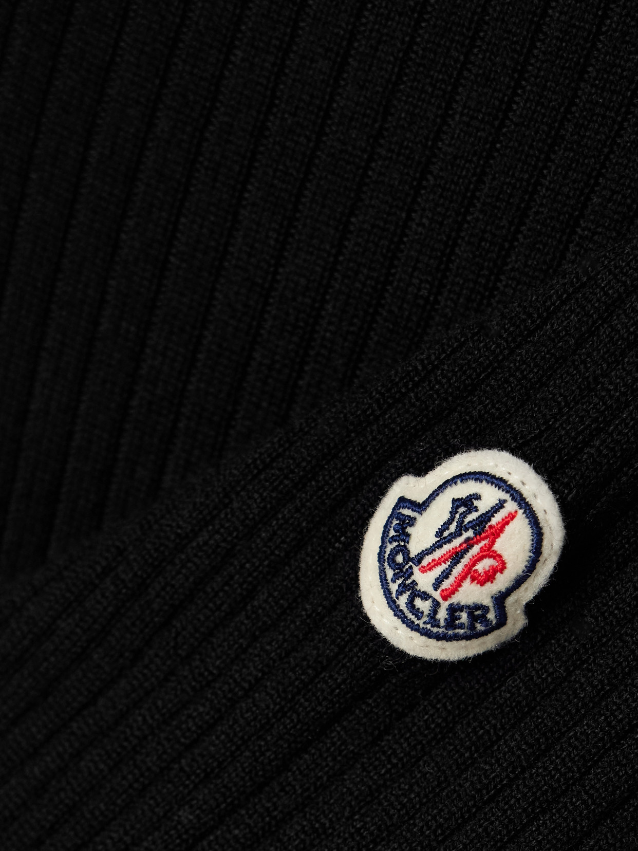 Moncler Appliqued Ribbed Wool Turtleneck Sweater In Black