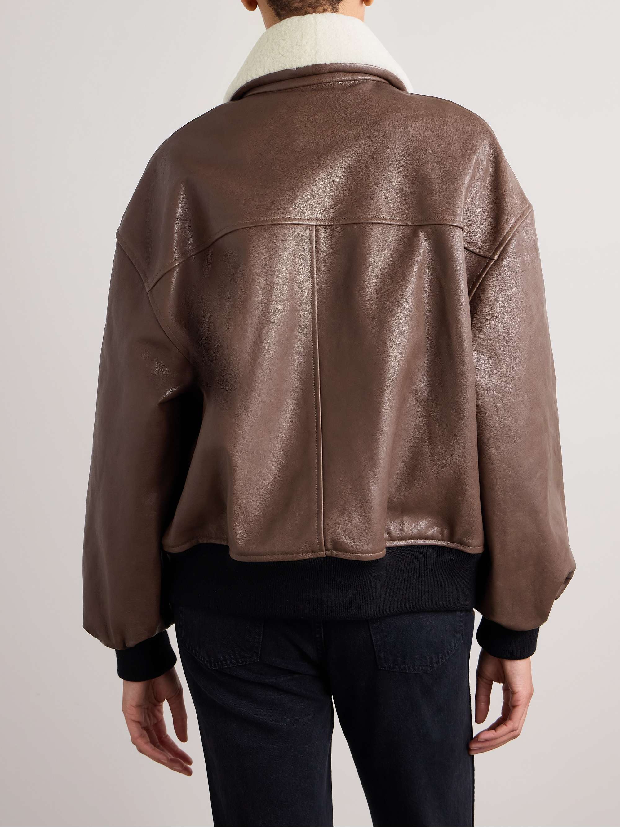KHAITE Shellar shearling trimmed leather jacket NET A PORTER