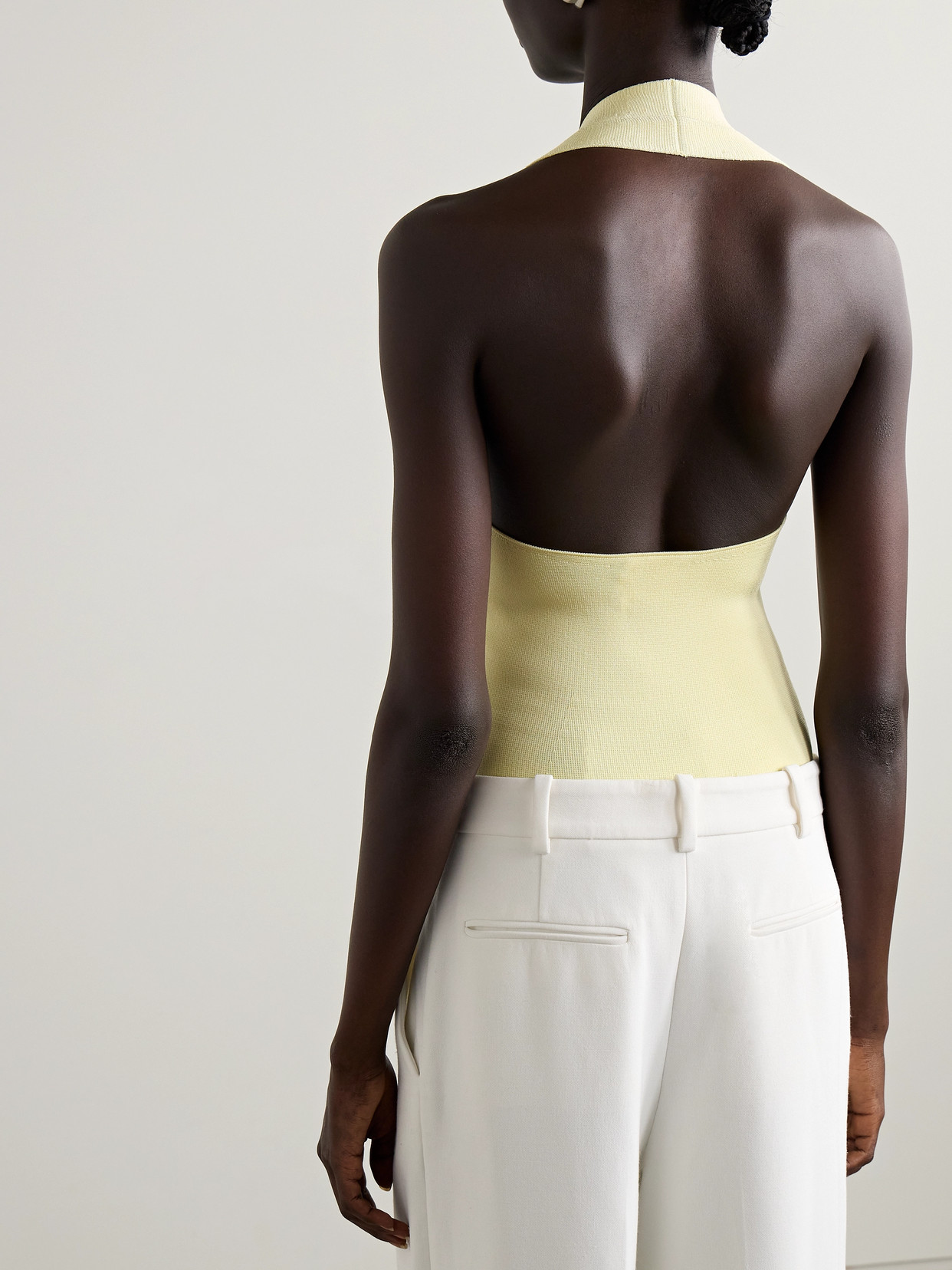 Khaite Toto Stretch-knit Halterneck Bodysuit In Yellow